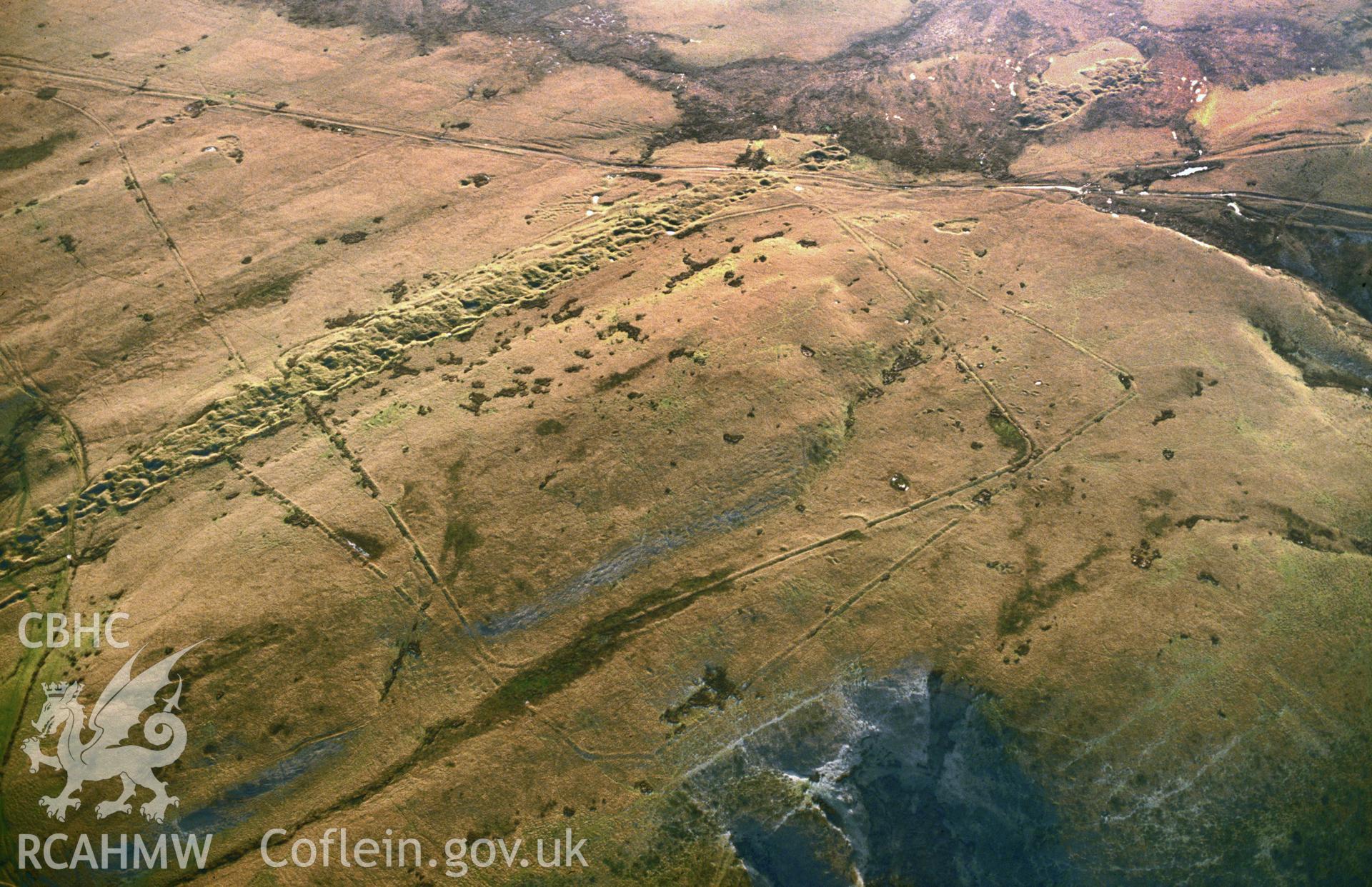 Slide of RCAHMW colour oblique aerial photograph of Y Pigwn Marching Camp, taken by C.R. Musson, 27/1/1992.