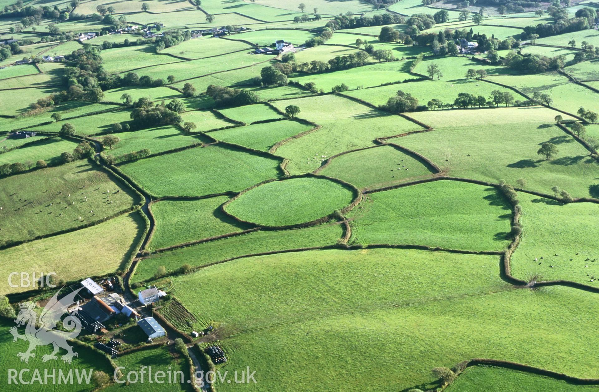 RCAHMW colour oblique aerial photograph of Cefnrhiwlas, hillfort? Enclosure. Taken by Toby Driver on 18/10/2002