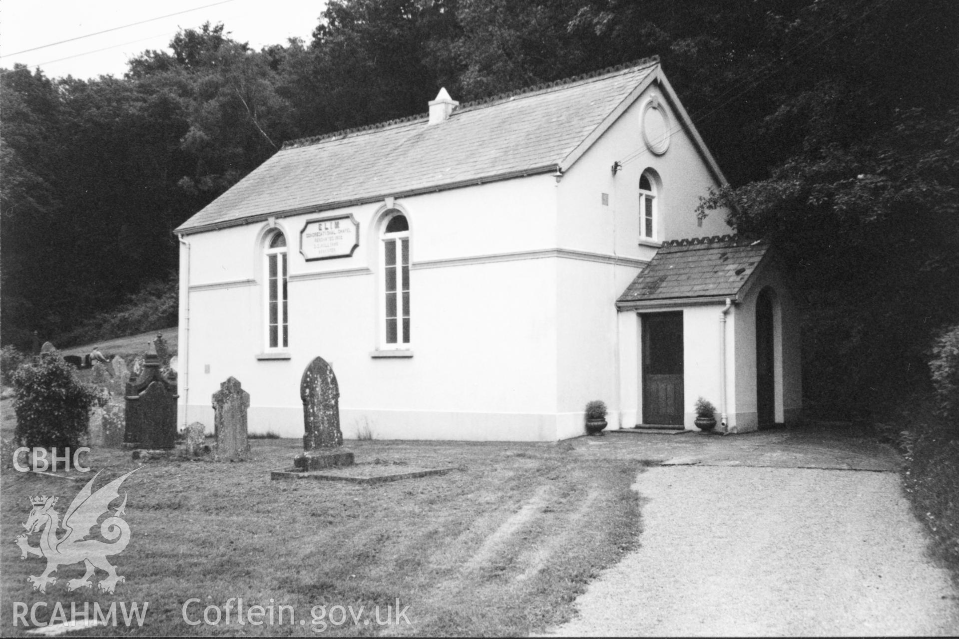 Digital copy of a black and white photograph showing an exterior view of Elim Welsh Independent Chapel, Eglwyscummin taken by Robert Scourfield, 1996.