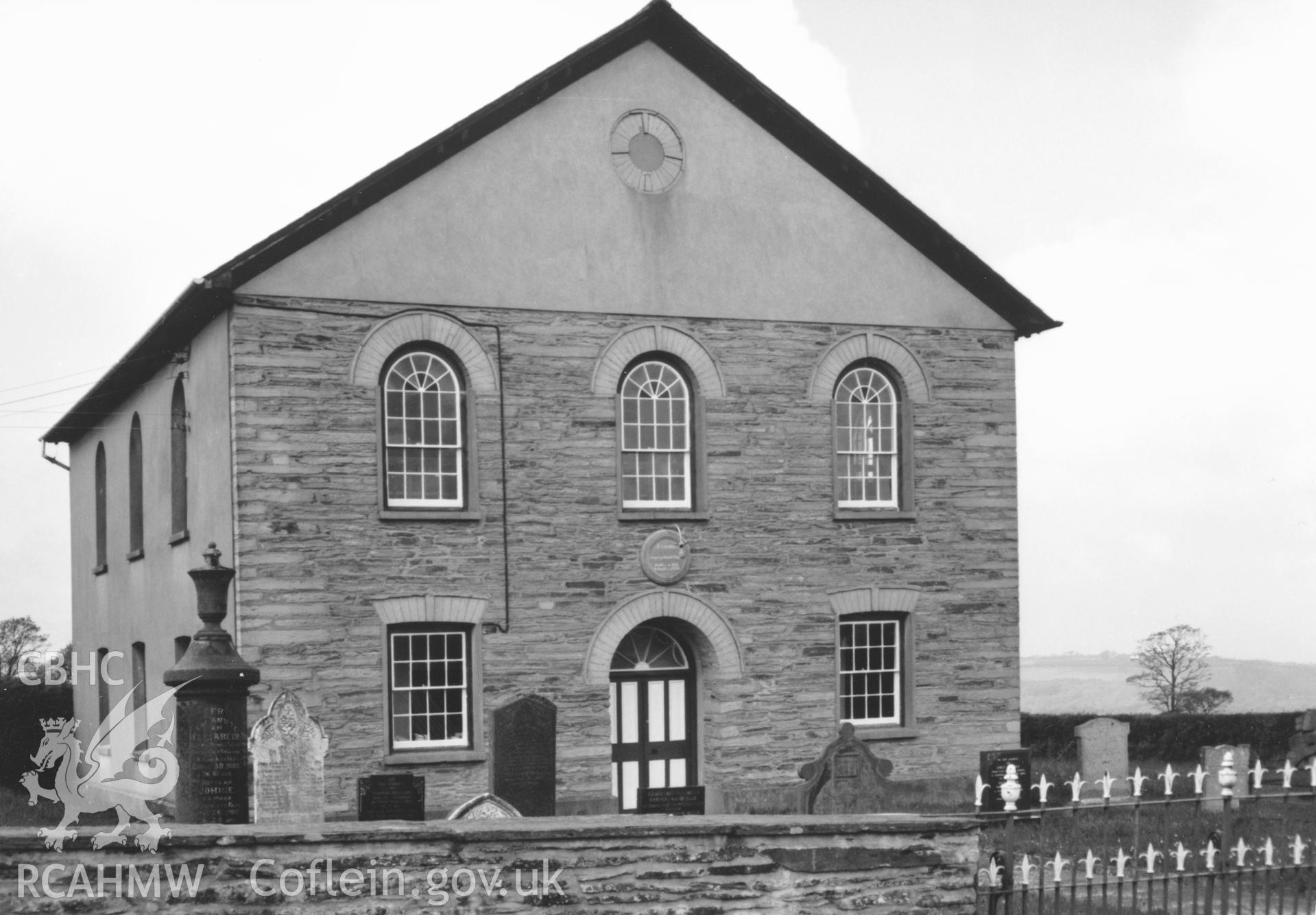 Digital copy of a black and white photograph showing a view of Ty Rhos Welsh Independent Chapel, Rhos Hill, taken by Robert Scourfield, c.1996.