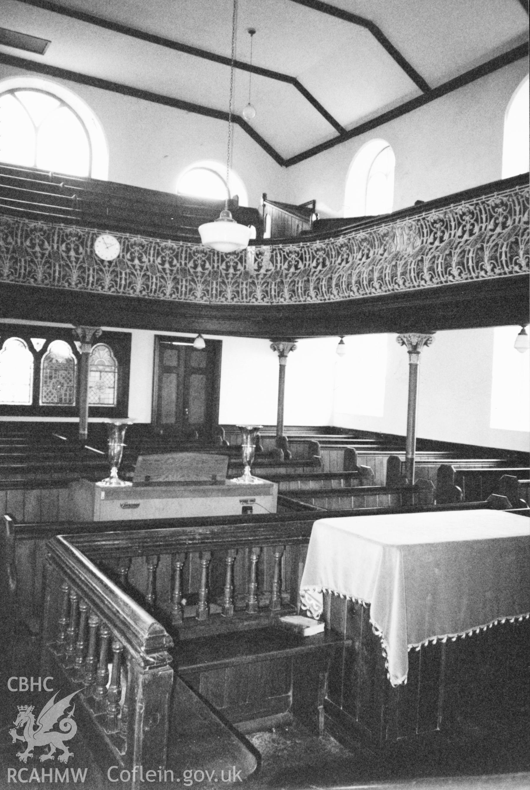 Digital copy of a black and white photograph showing an interior view of Moreia Welsh Independent Chapel, Blaenwaun, taken by Robert Scourfield, 1996.