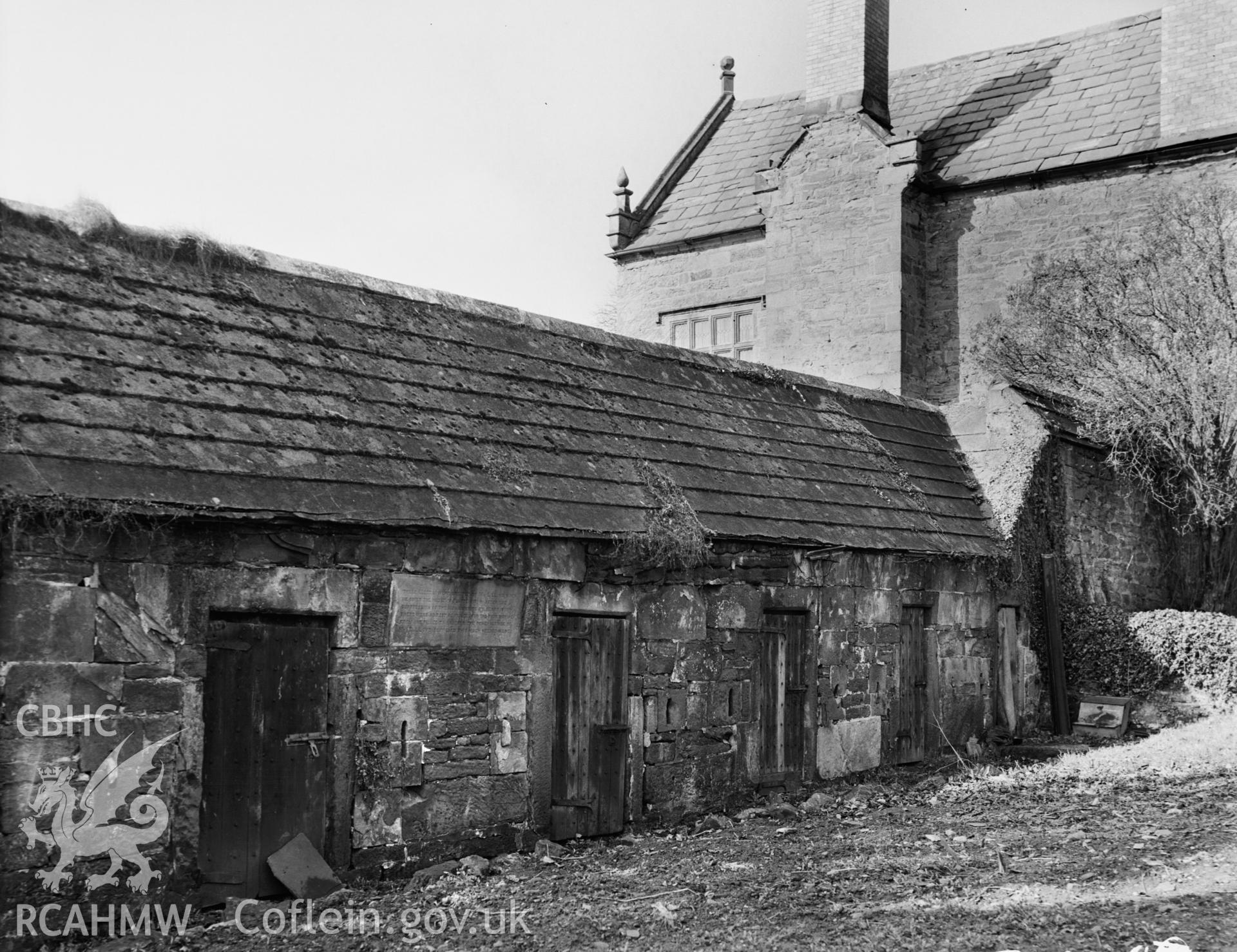 Exterior view showing buildings attached to the rear of the house
