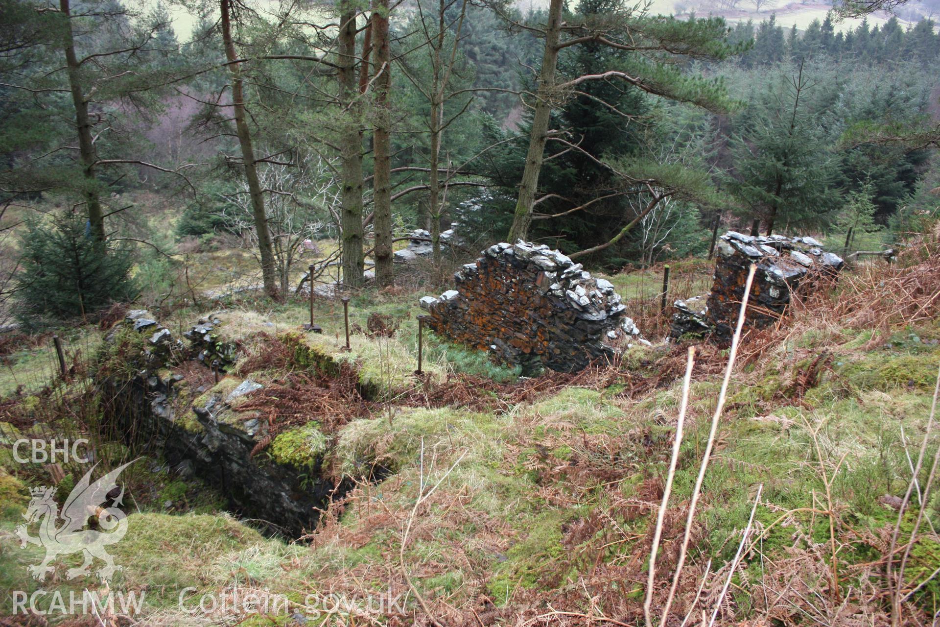 Ystrad Einion metal mine.  Looking south-east across the remains of wheel pit 1 to the blacksmiths.