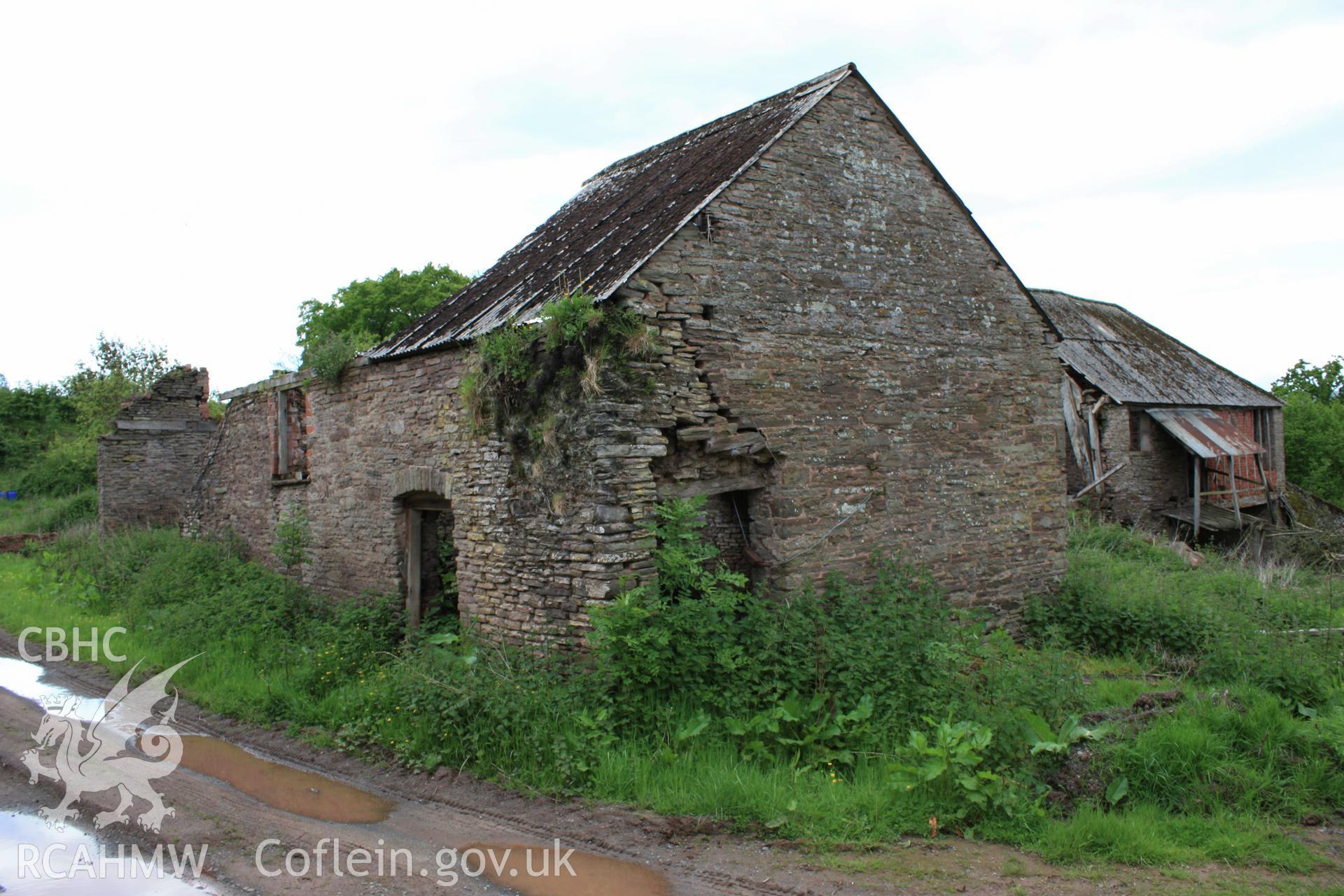 3/4 view from north-east showing stable in foreground.