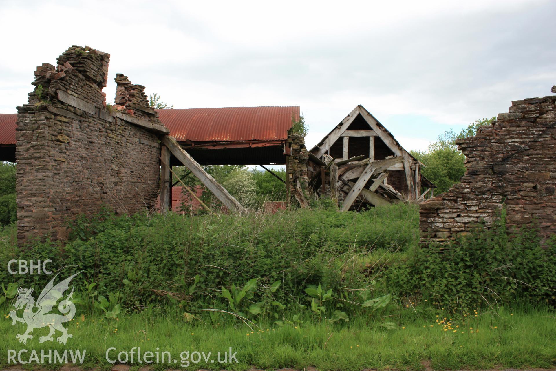 View from east showing cart-house in foreground.
