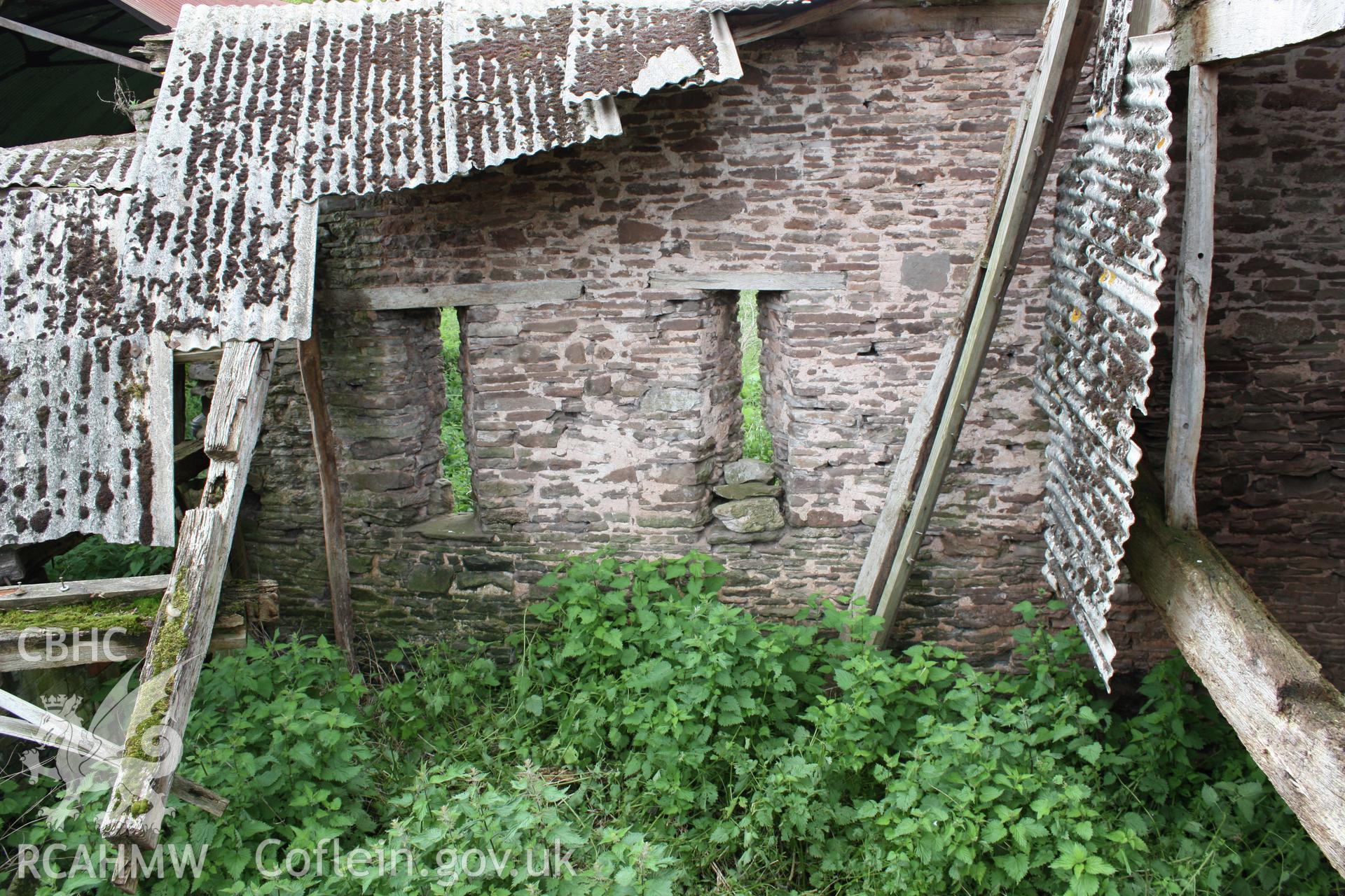 Interior of Barn range showing ventilation slits to south wall.