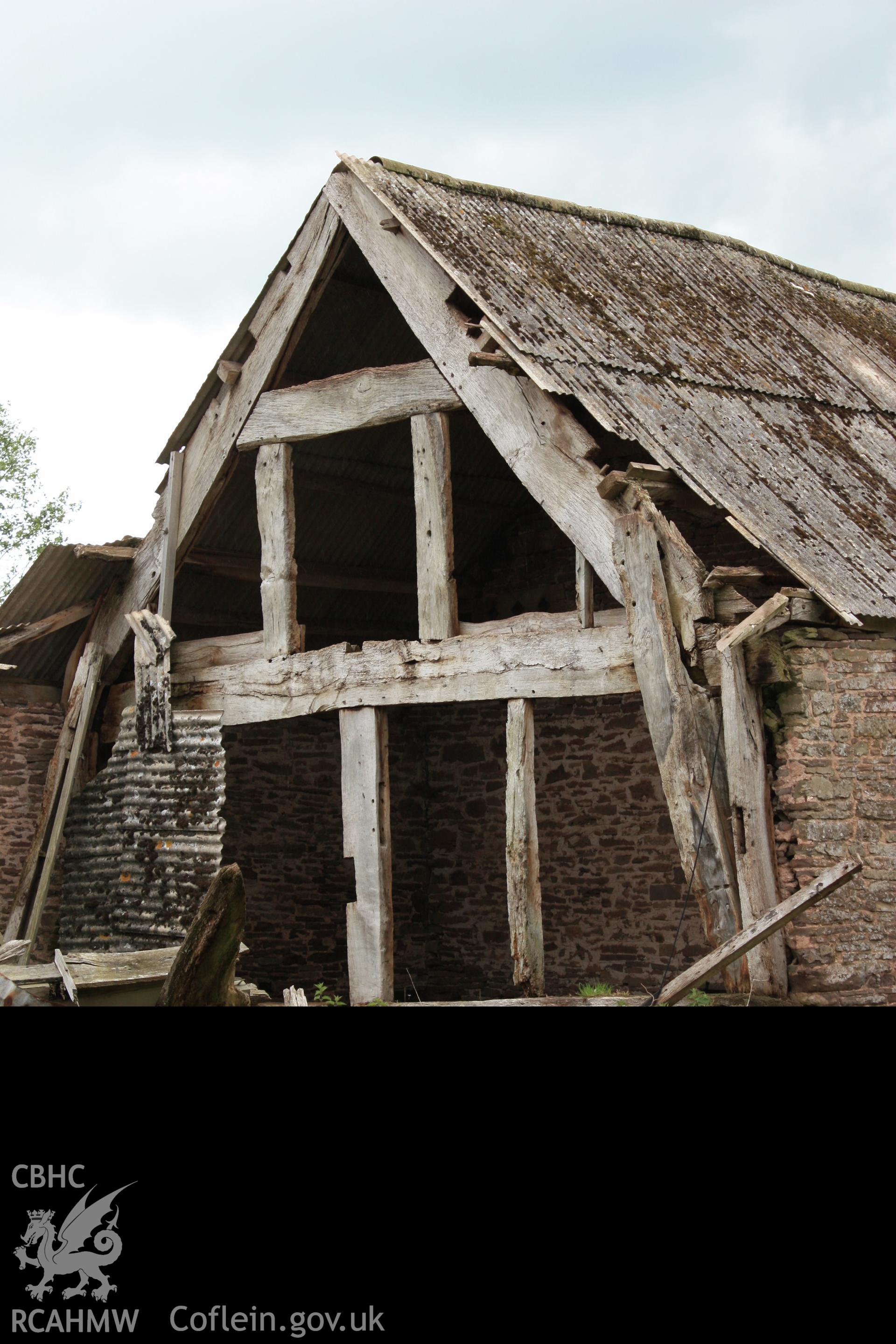 View from north-east showing low end cruck truss of barn range.