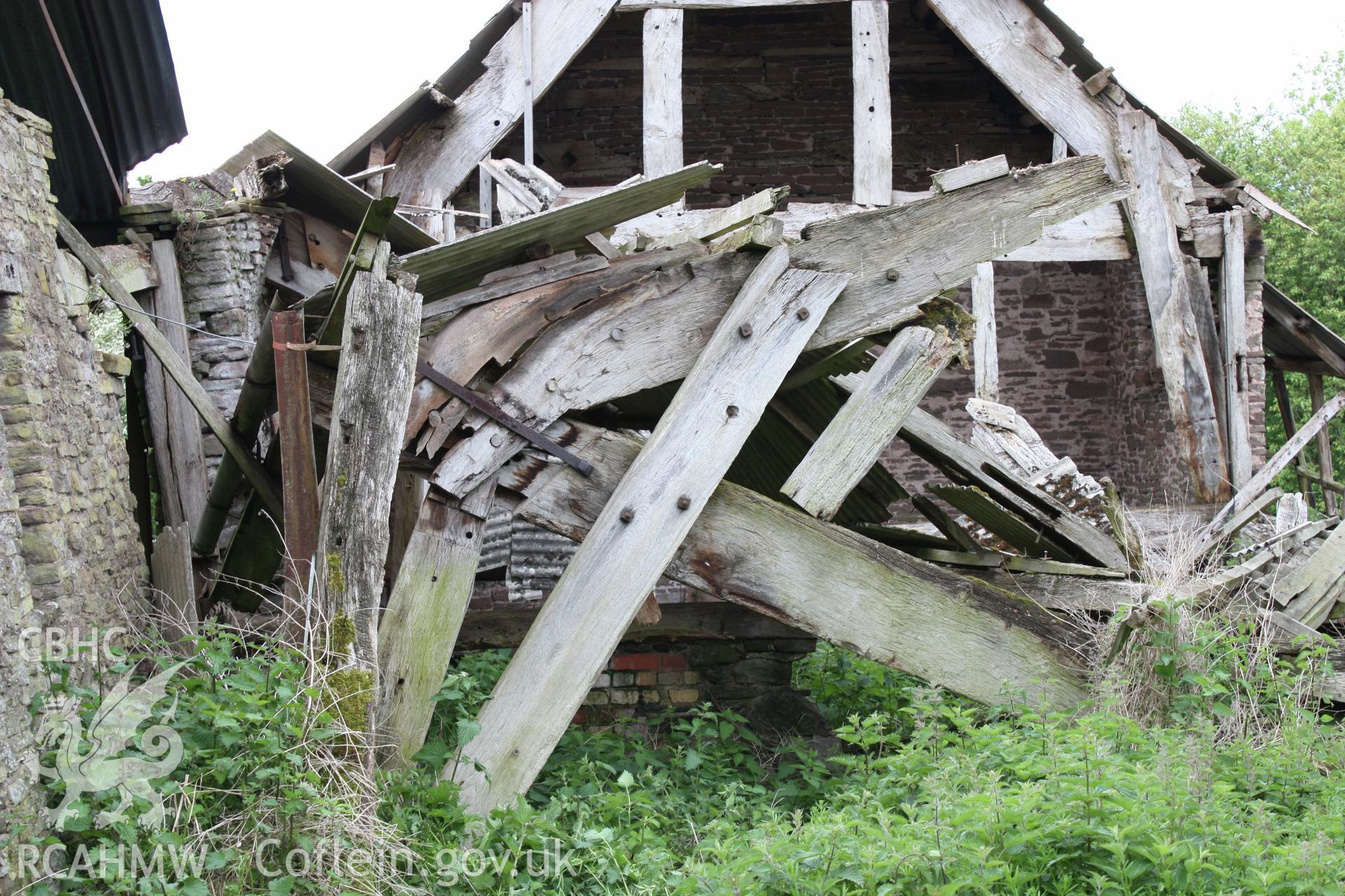 Interior of Barn range showing the threshing-bay cruck truss.