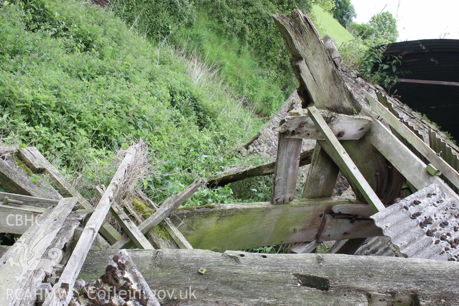 Interior of Barn range showing the threshing-bay cruck truss.