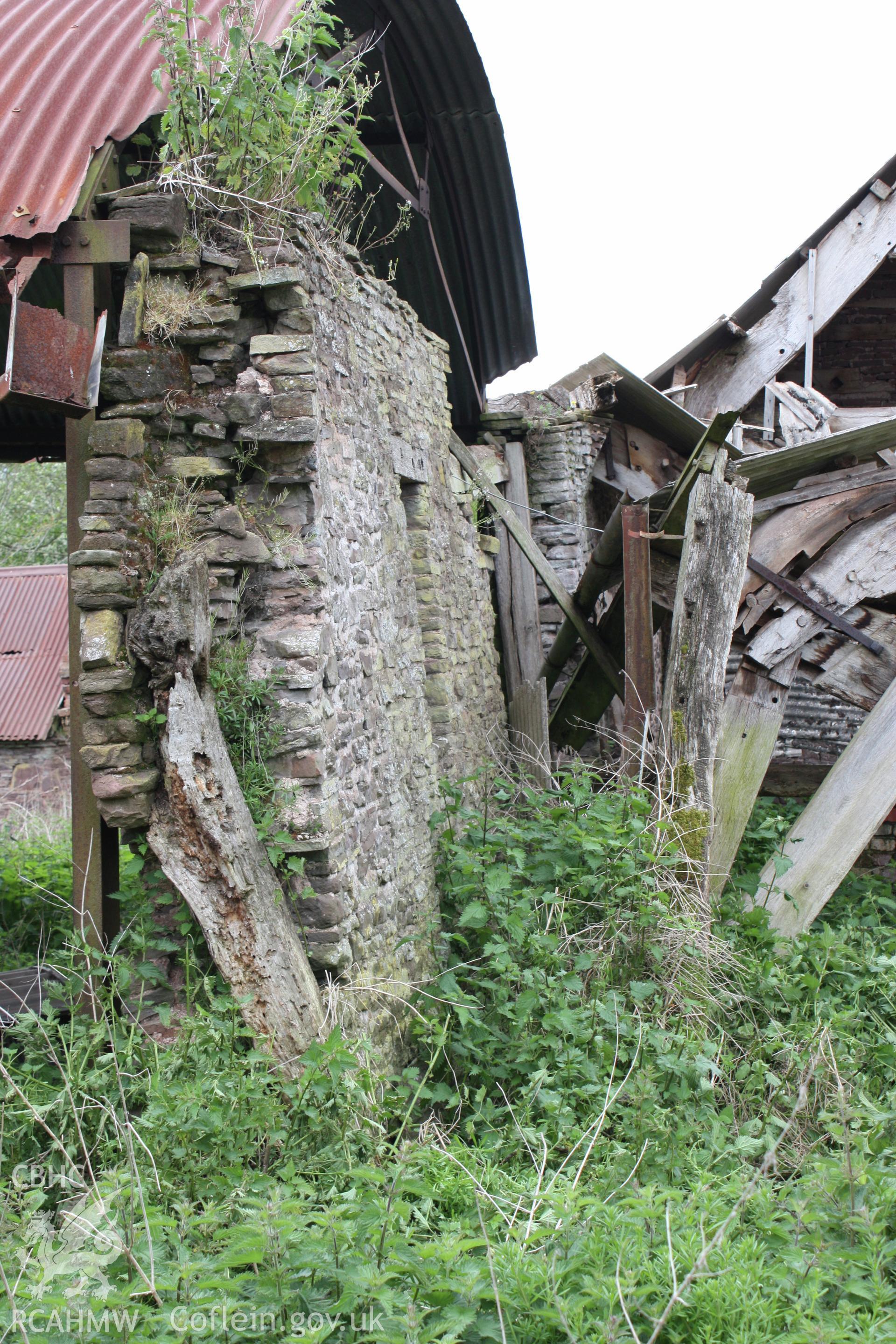 Interior of Barn range showing the remnants of the upper end cruck blade.