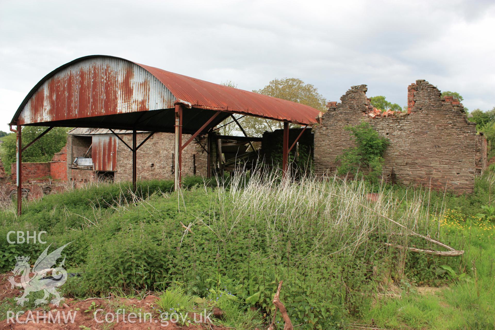 3/4 view from south-east showing Hay-shed in foreground.