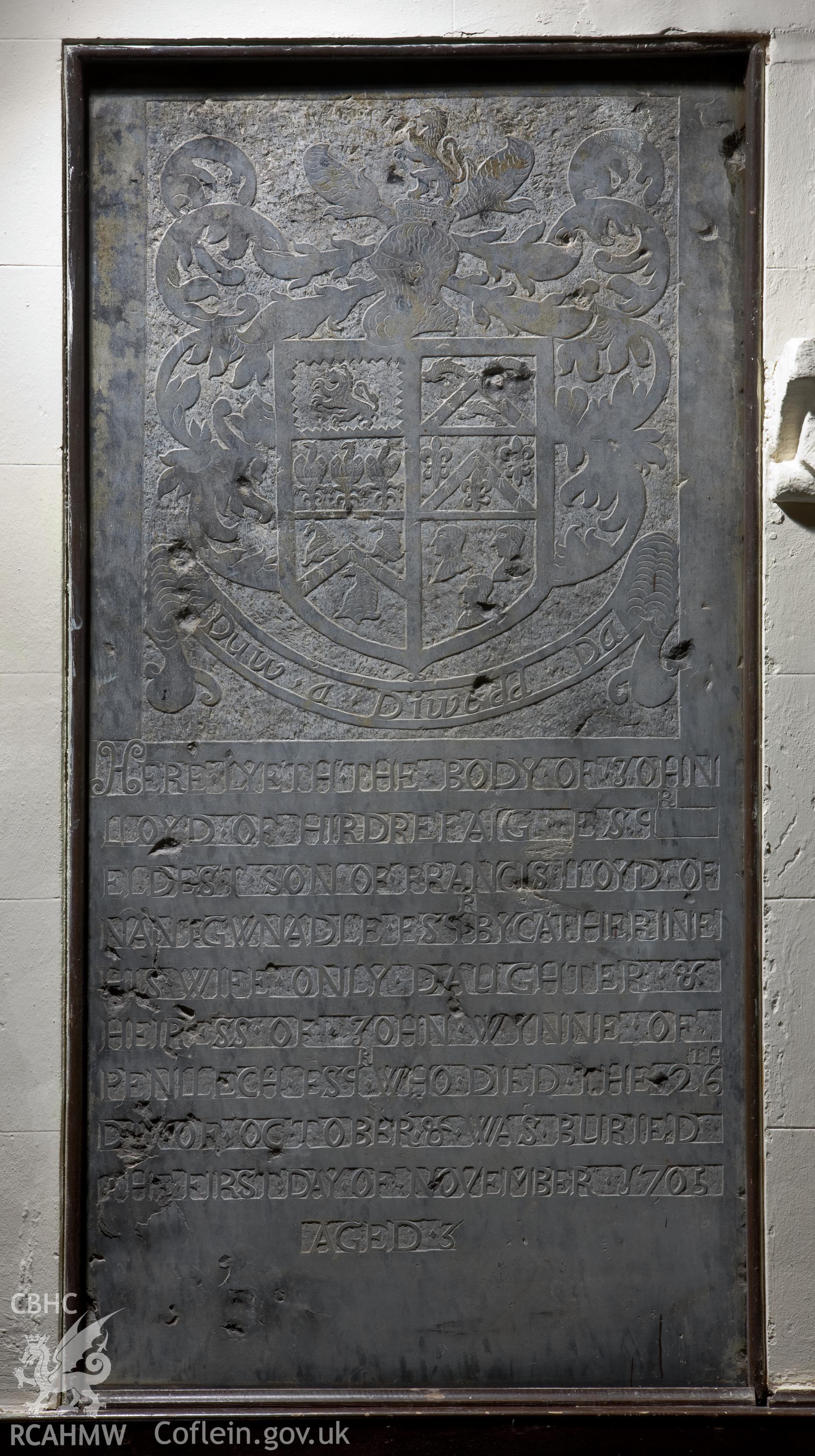 Carved slate memorial slab on southeast wall.