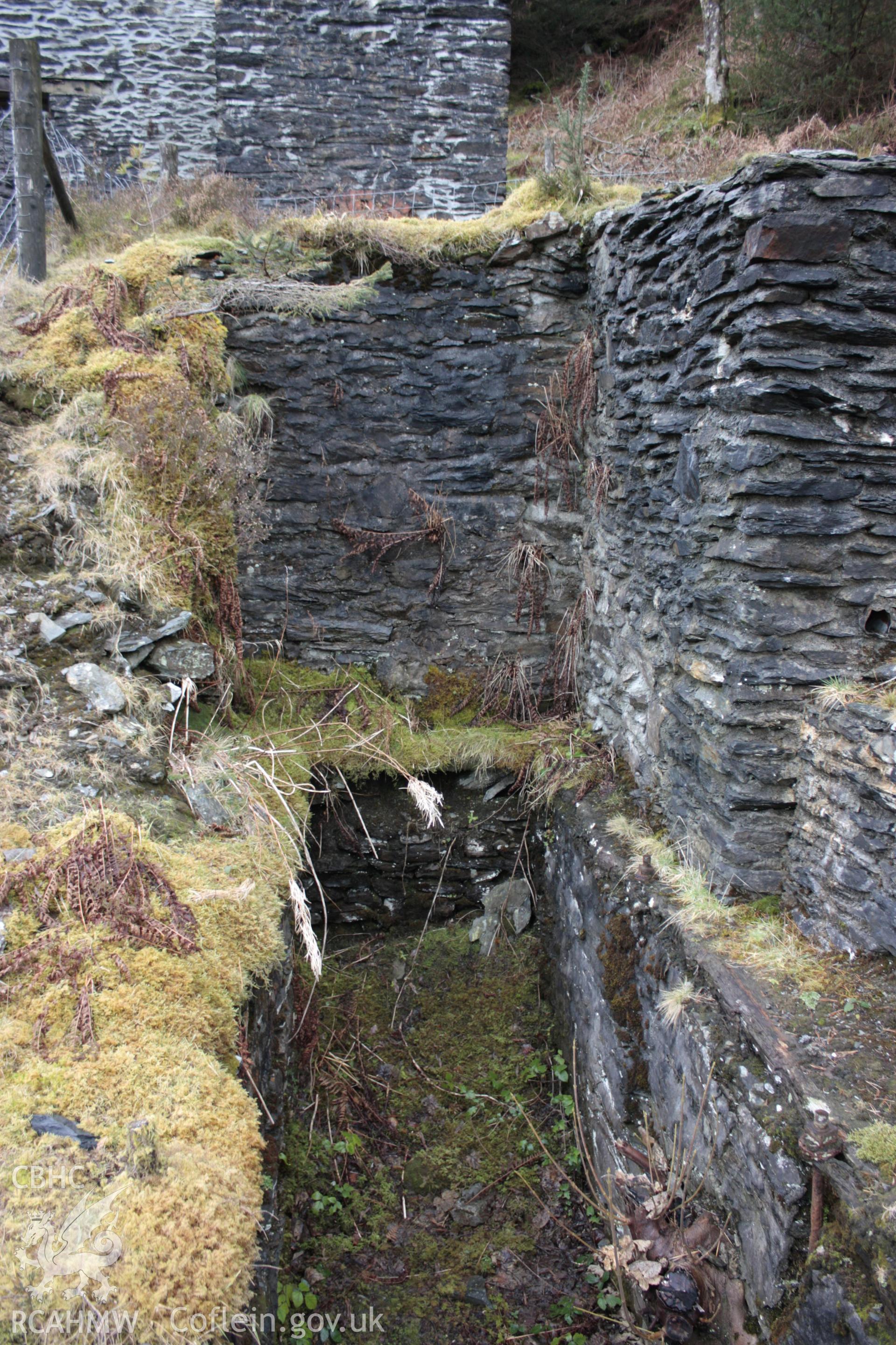 Ystrad Einion metal mine.  Looking south-west along wheel pit 3.  Wheel 3 (5.49m diameter) powered the jiggers and buddles.