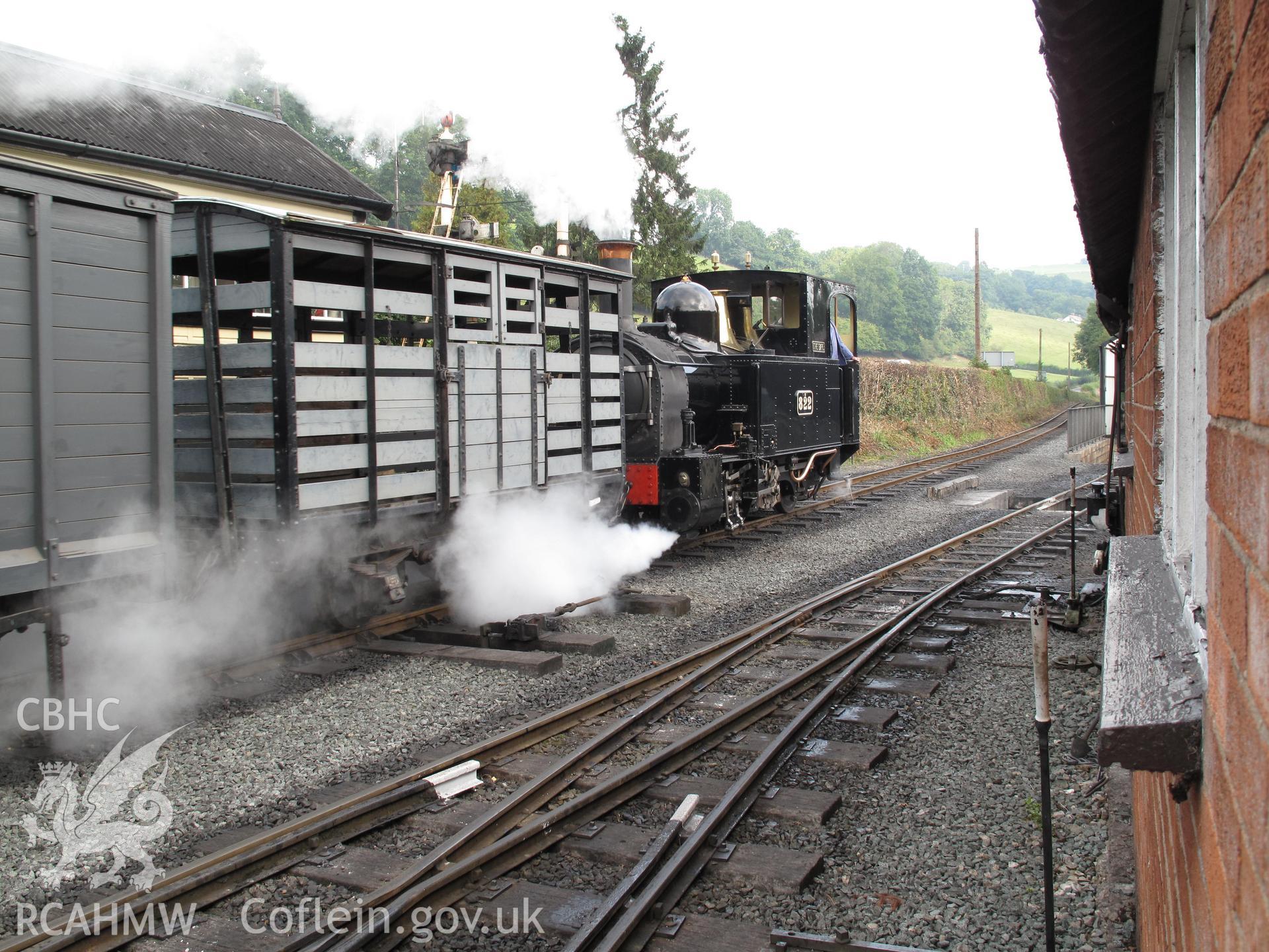 Goods train leaving Llanfair Caereinion railway station behind no. 822 'The Earl', taken by Brian Malaws on 03 September 2010.