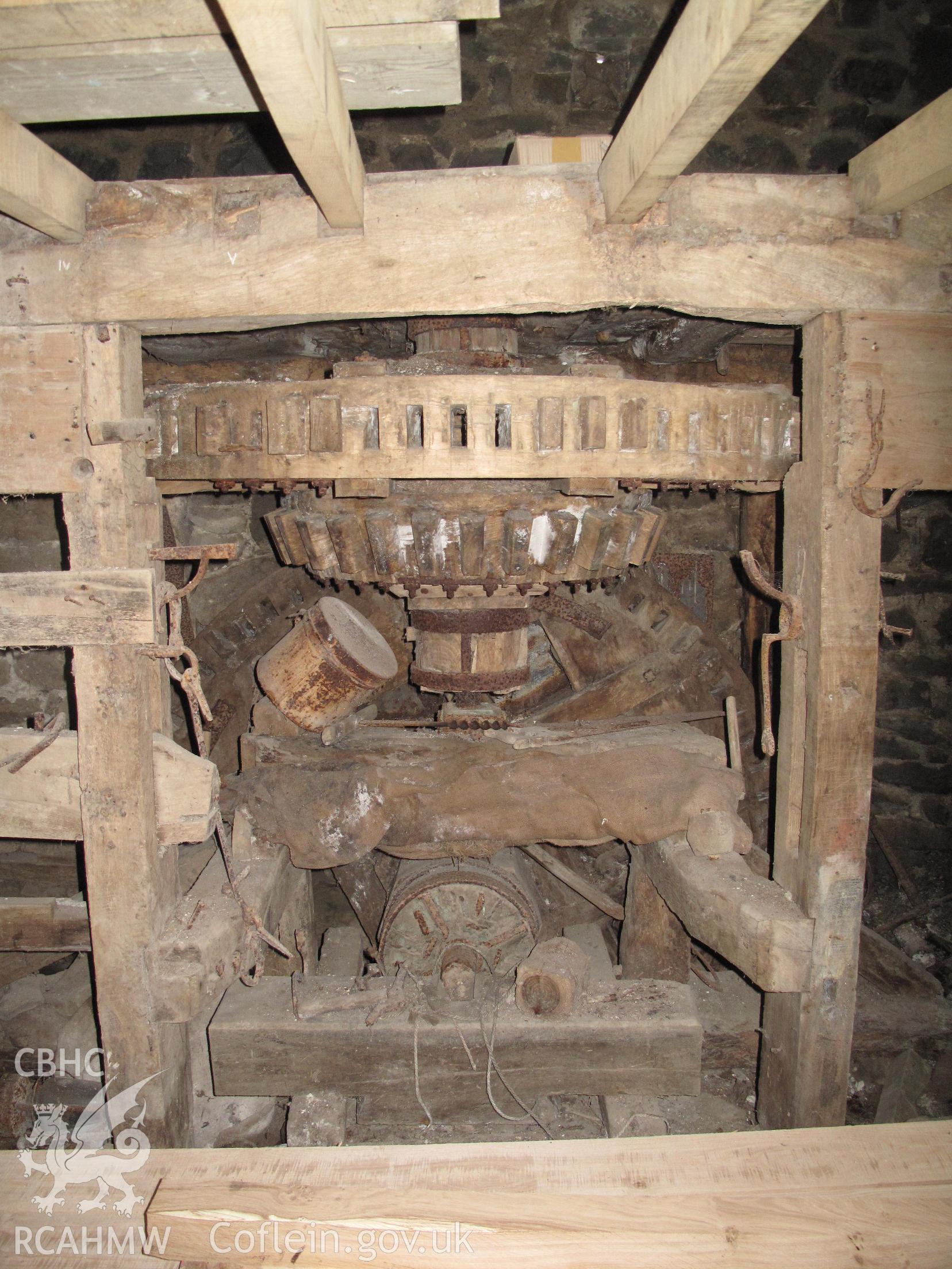 Coedtrewernau corn mill interior showing hurst frame and early wooden gearing.