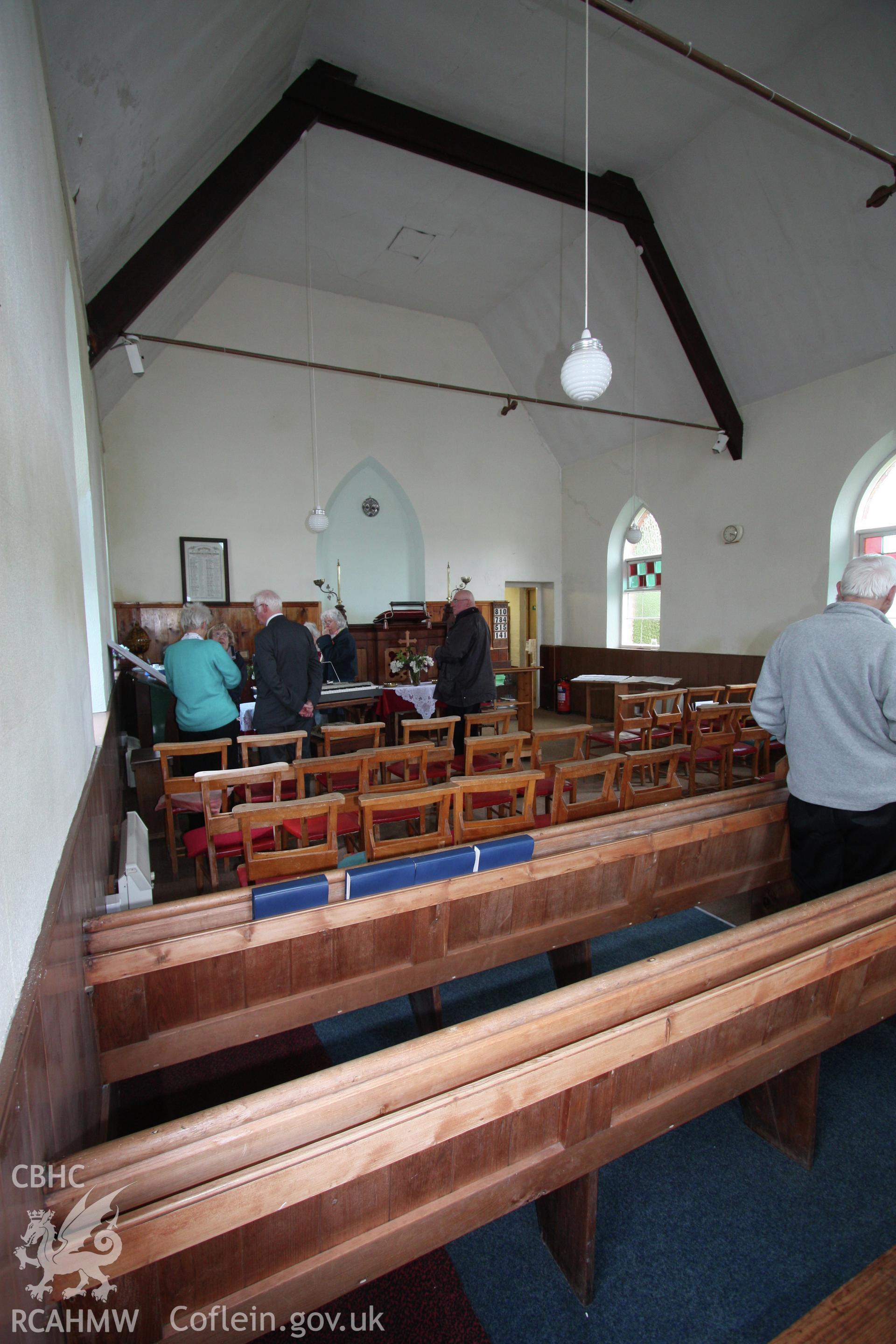 Interior, view towards pulpit, showing pews