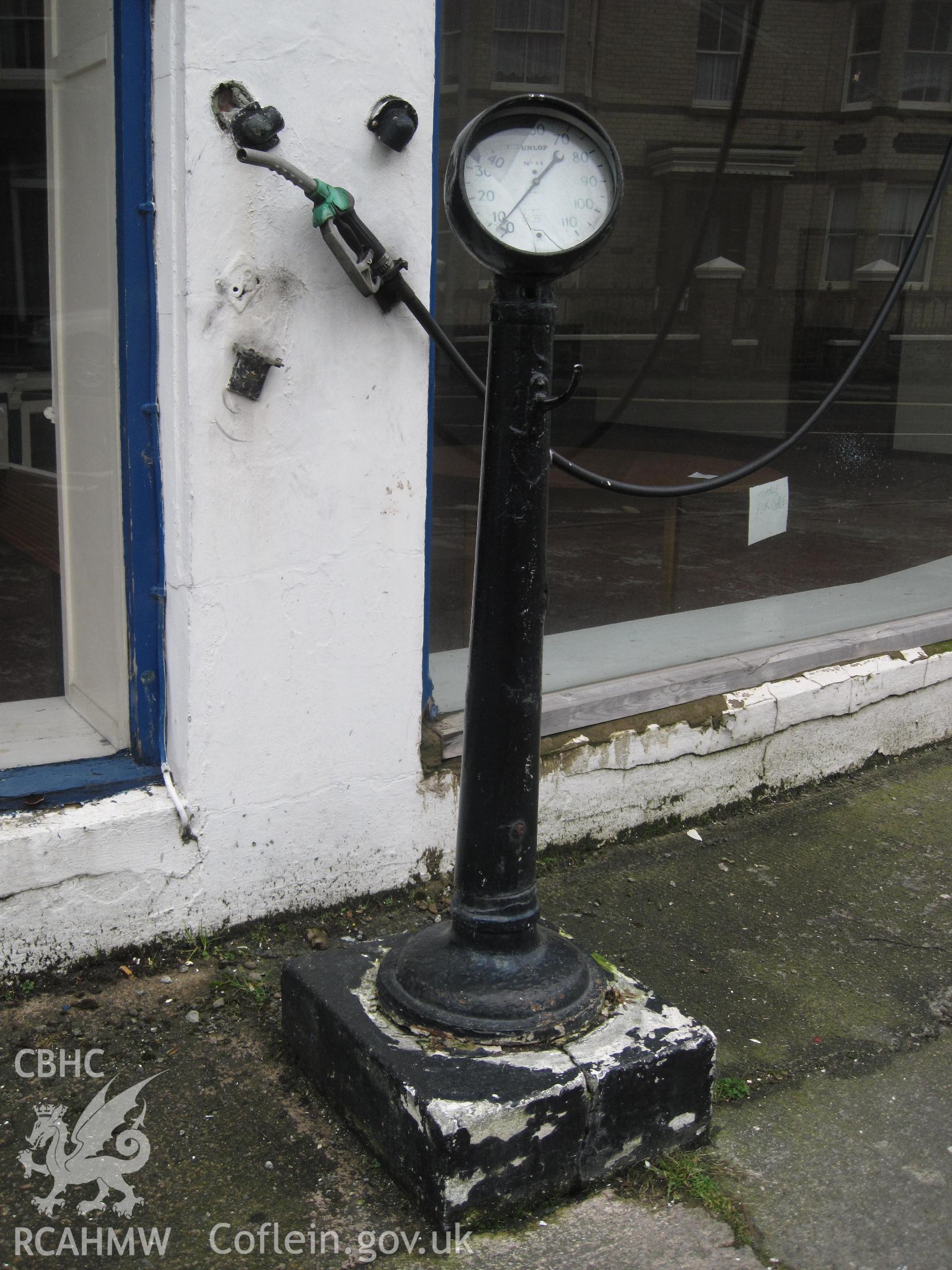 Air line pedestal and Dunlop No.68 tyre pressure gauge at Pritchard's Garage, Llandrindod Wells.