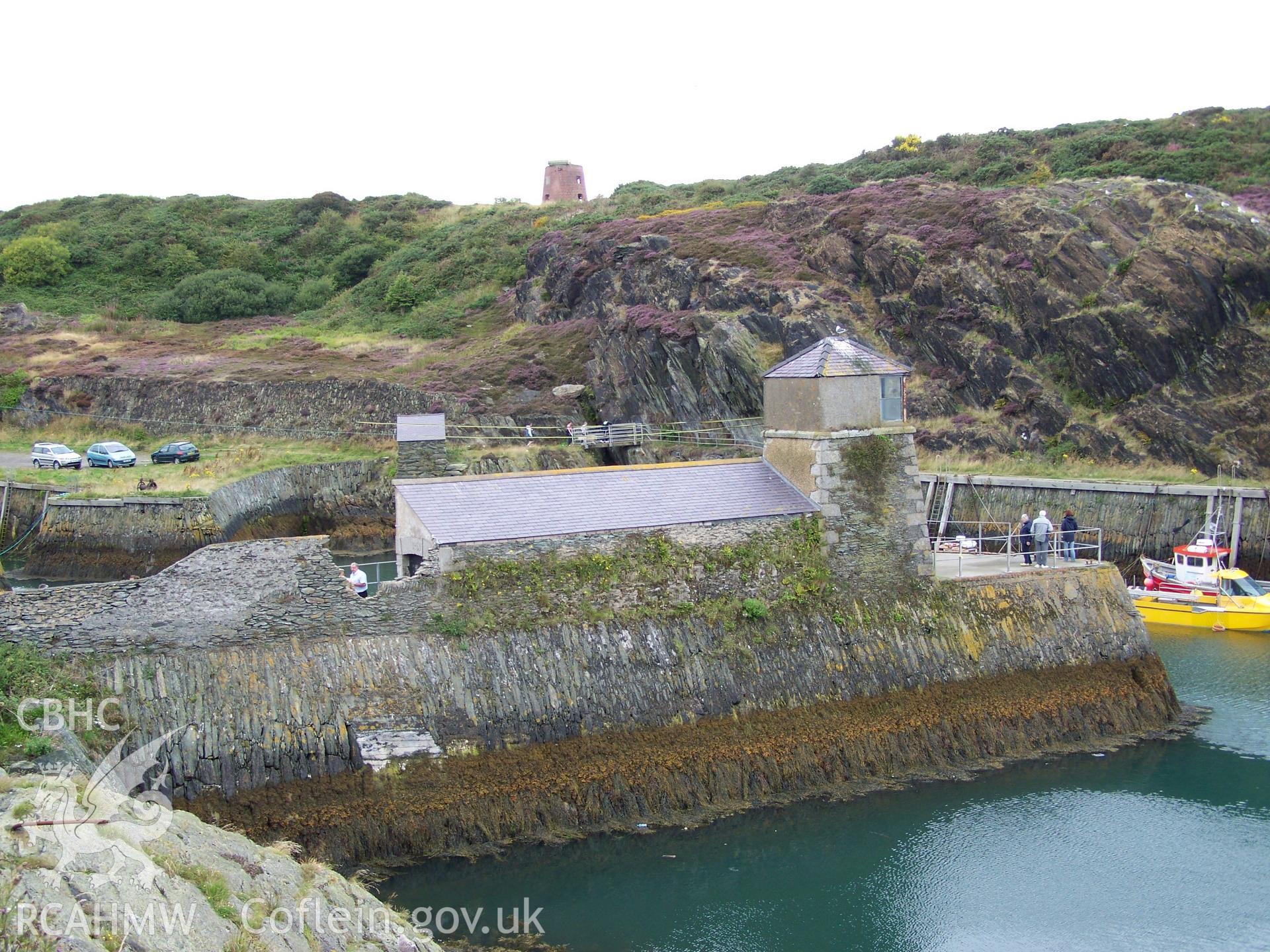 Outer wall of the quay creating the refuge harbour surmounted by the Watchhouse and its leading light. The gap to the left of the Watchhouse shows the former location of the Harbour Master's house (now demolished).