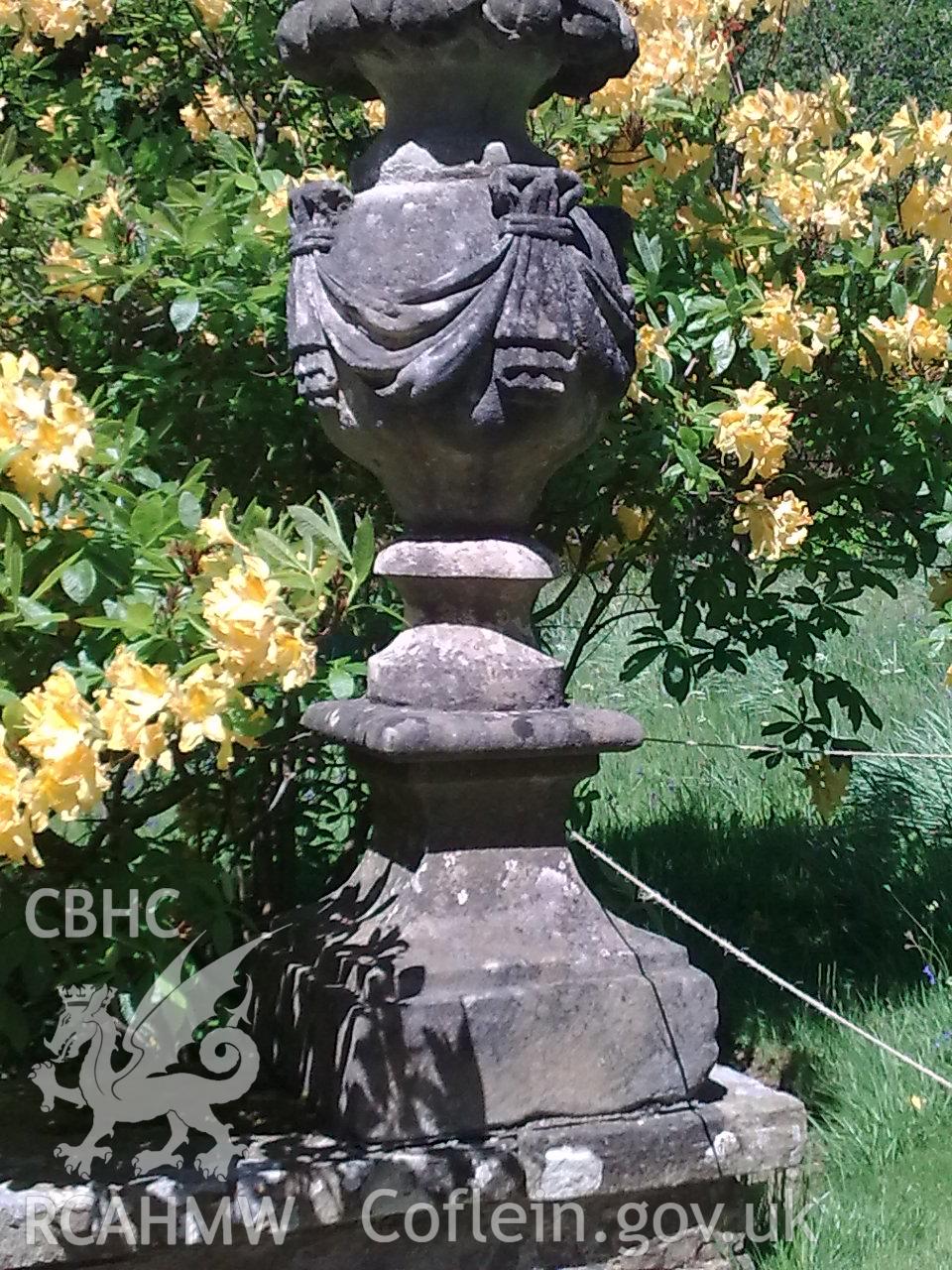 Detail of one of the decorative stone urns flanking the steps down to The Poem Mausoleum, Bodnant.