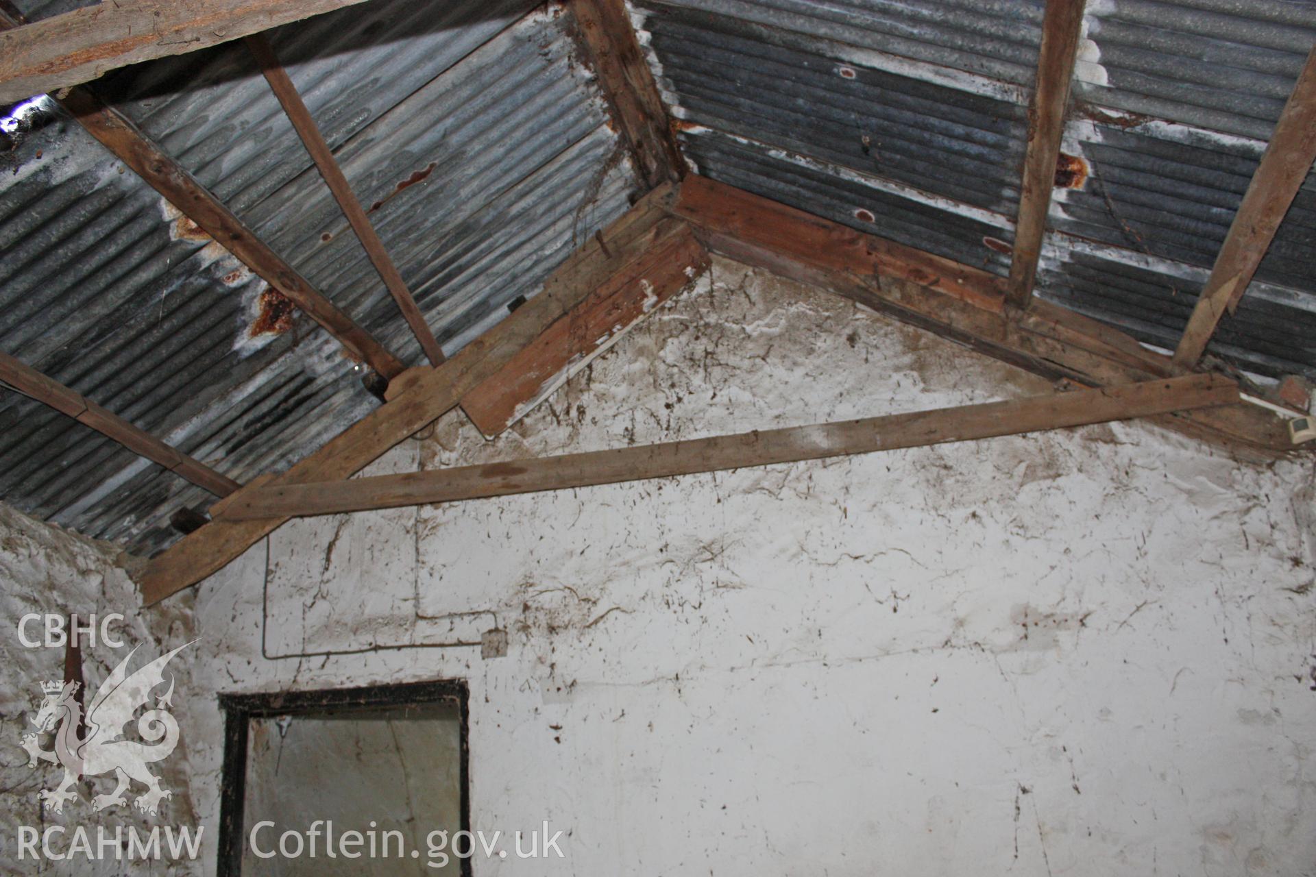Interior, cow-house, showing roof truss at north-east cross-wall.