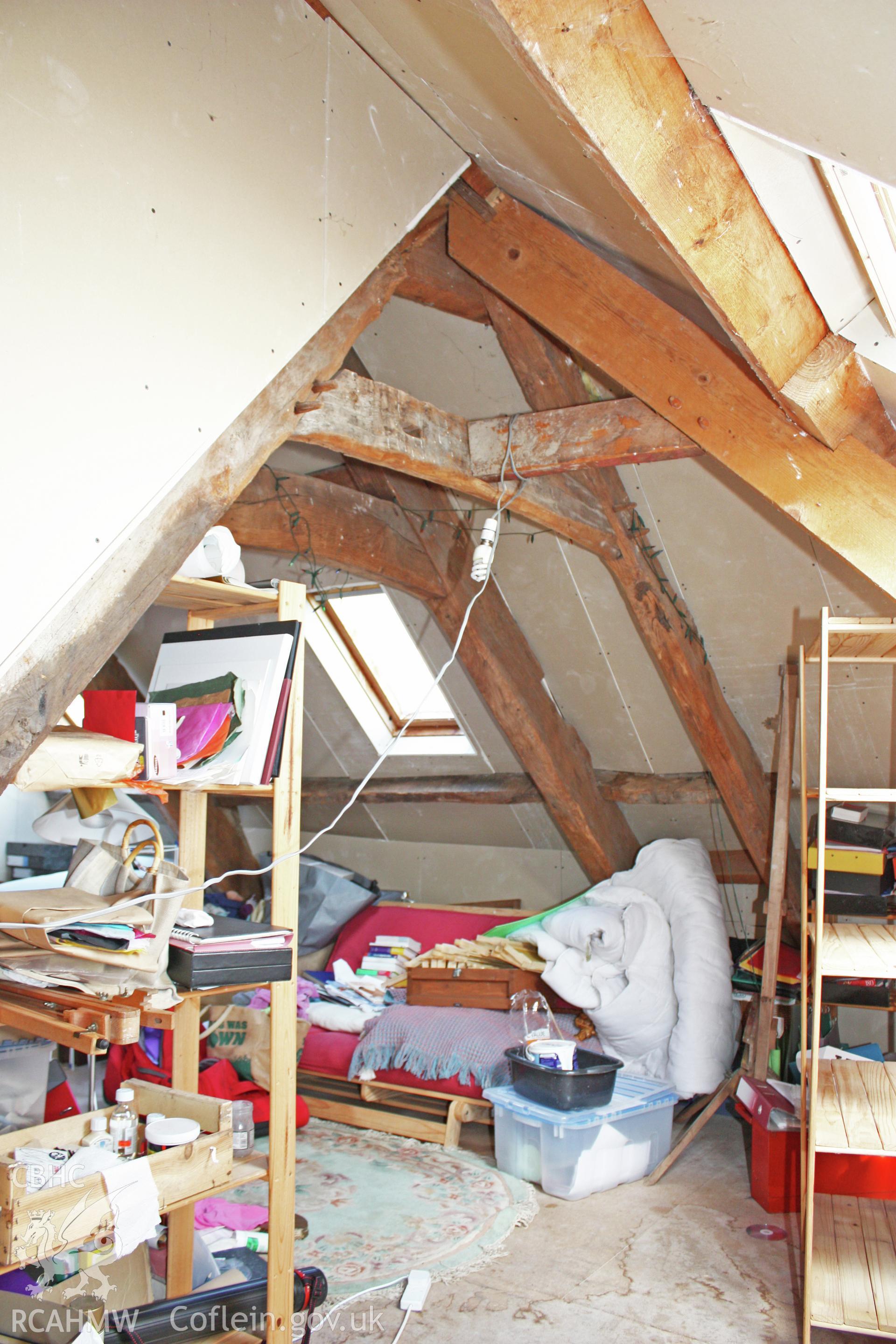Glantywi House, interior view, hip-truss with truss over hall beyond.