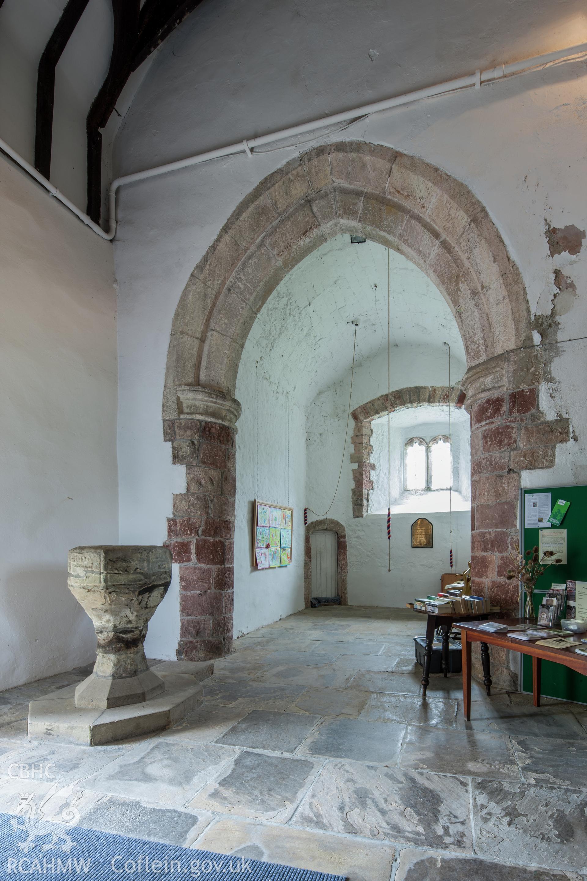 Interior view, base of tower and font.