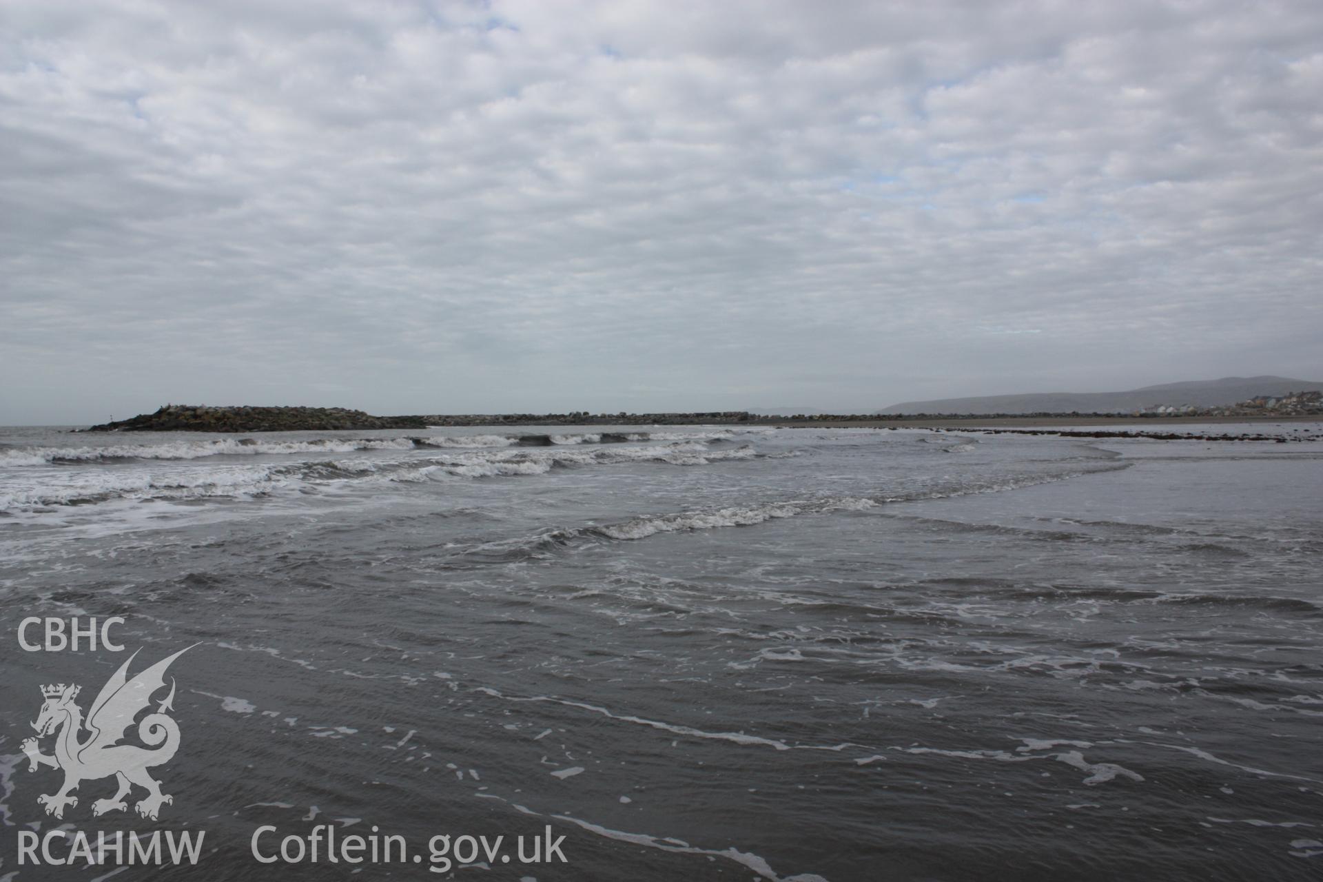 Borth submerged forest (between RNLI lifeboat station and upper Borth), looking towards High Street and Ynyslas. Showing extent of peat exposures (centre right) below temporary causeway leading to artificial reef (centre left-right).