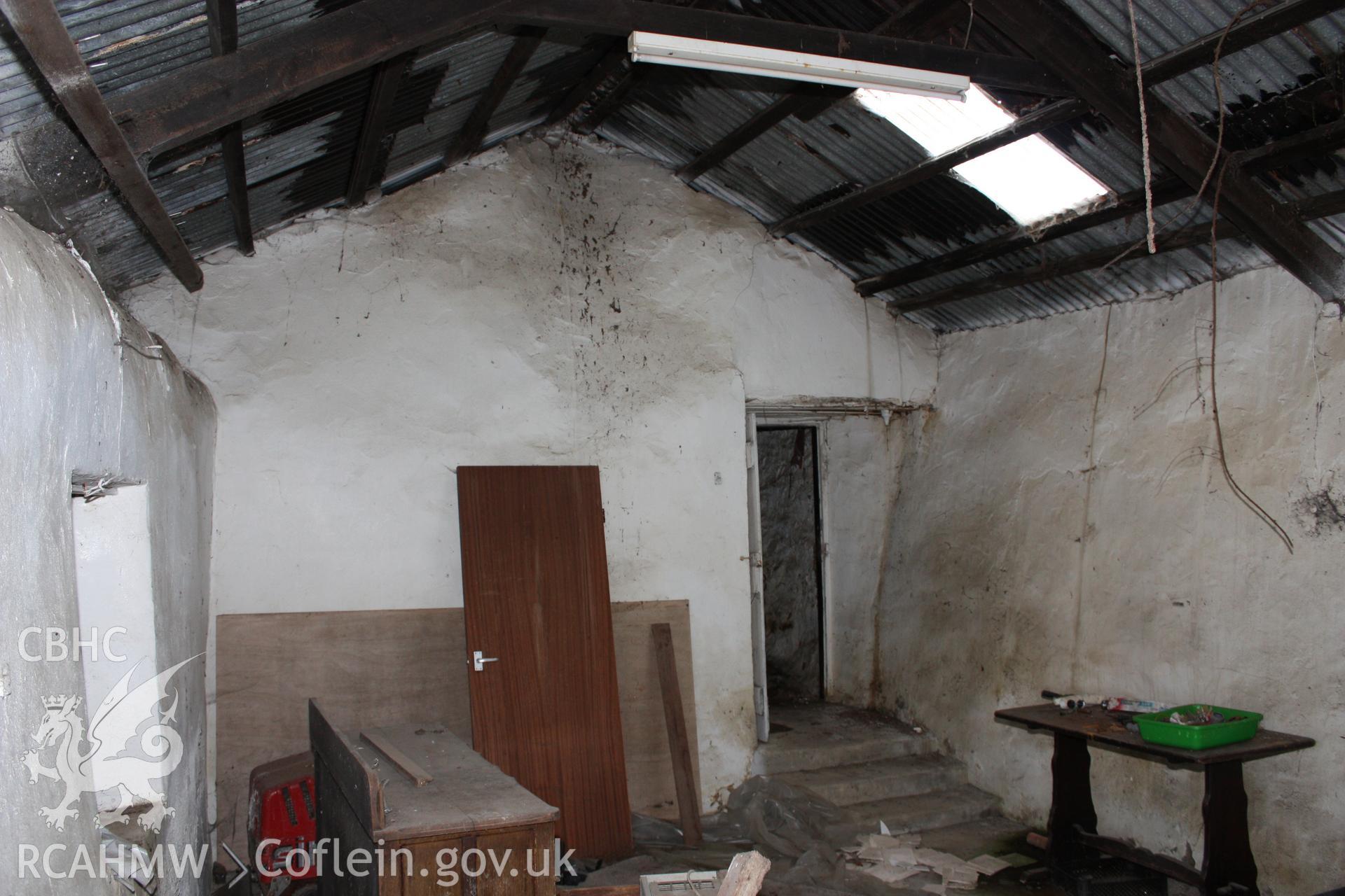 Interior, smithy, view towards cross-wall.