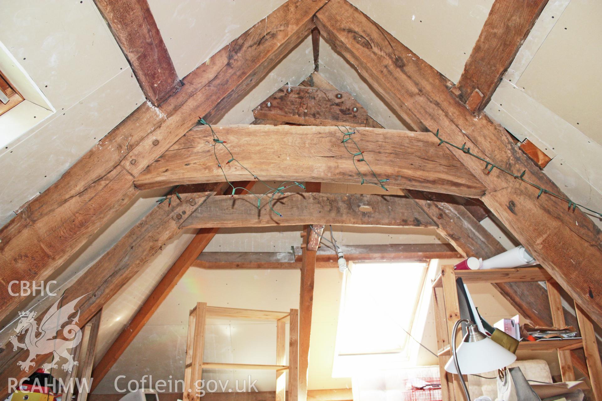 Glantywi House, interior view, roof-truss over hall with later hip truss beyond.