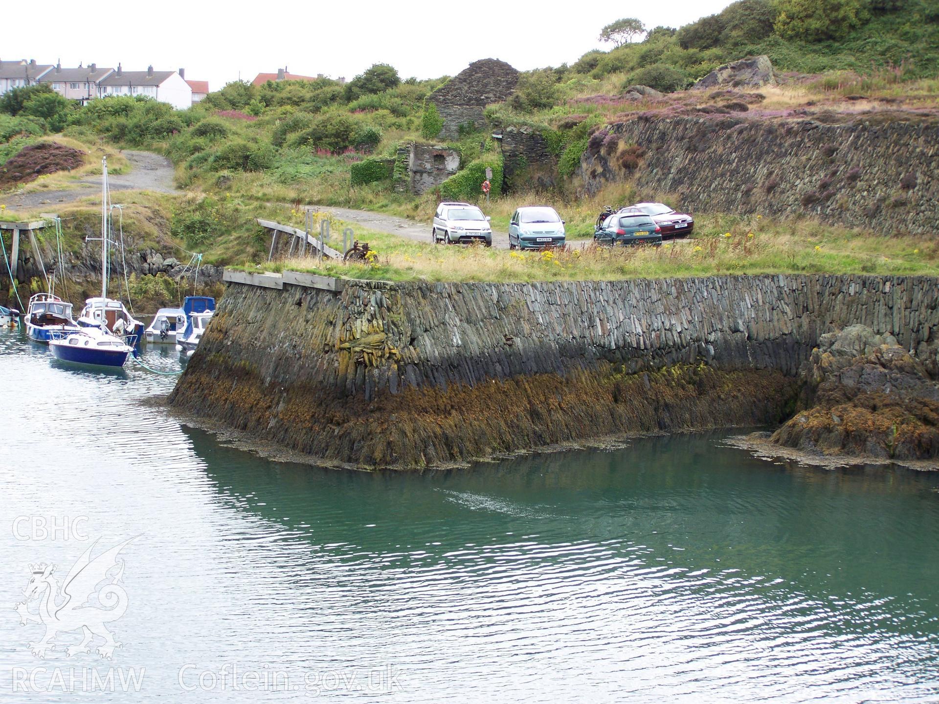 The profile of the former launching/hauling out slip can be seen in cross-section in the dry-stone walling infill in the quay's face.