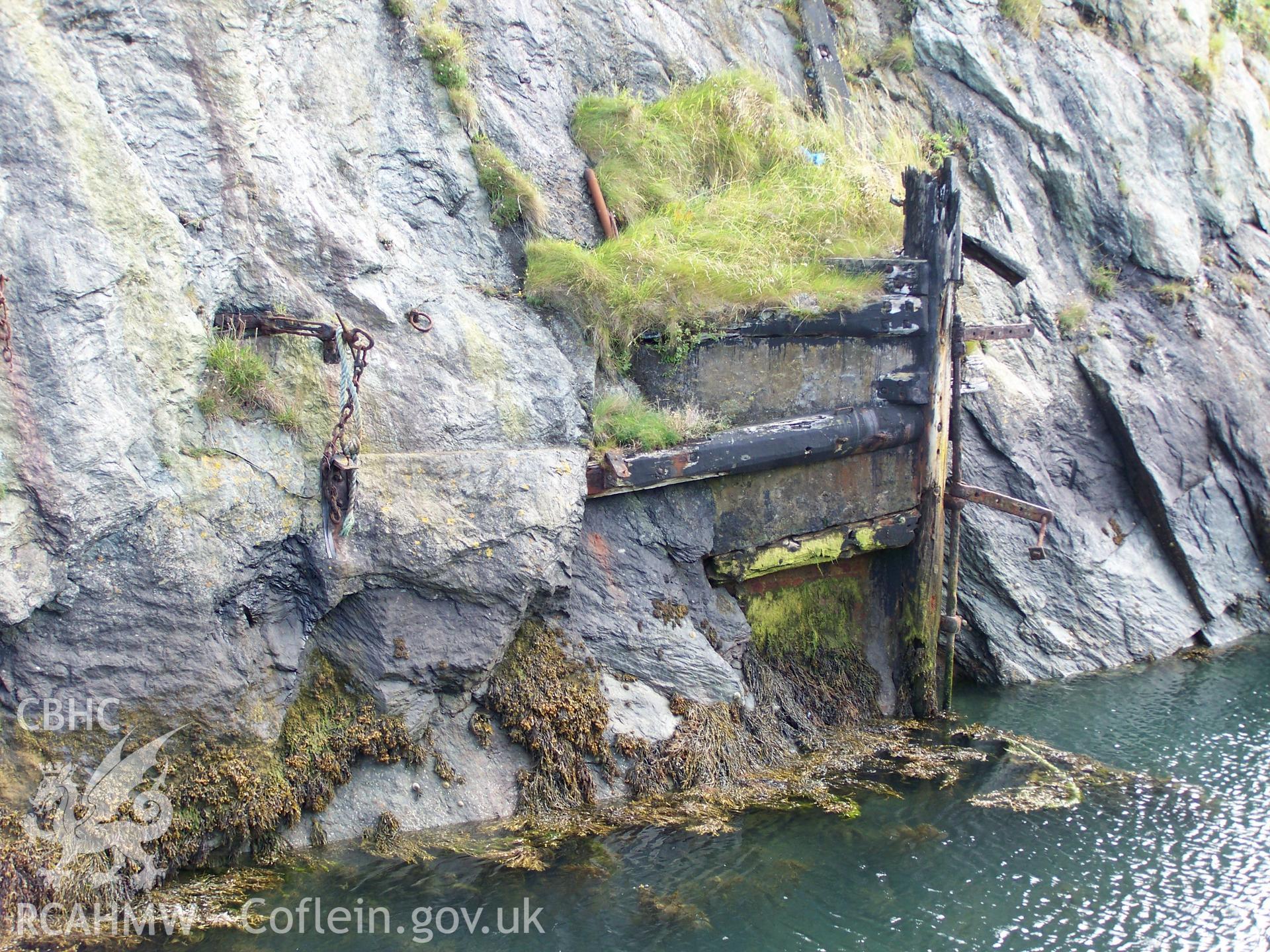 The dock gate support and surviving hinge on the southern side of the dry dock.