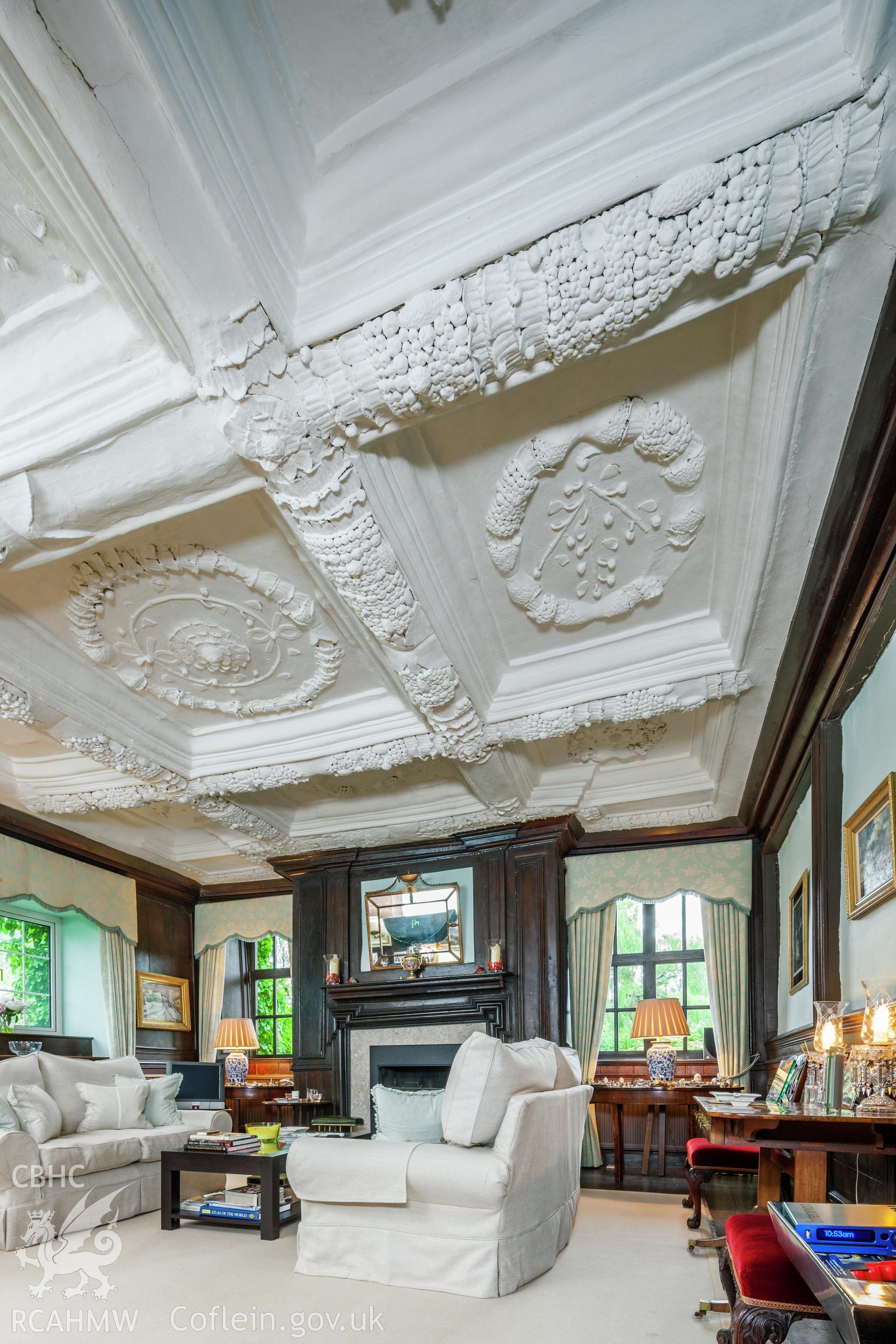Interior of parlour with decorated plaster ceiling.