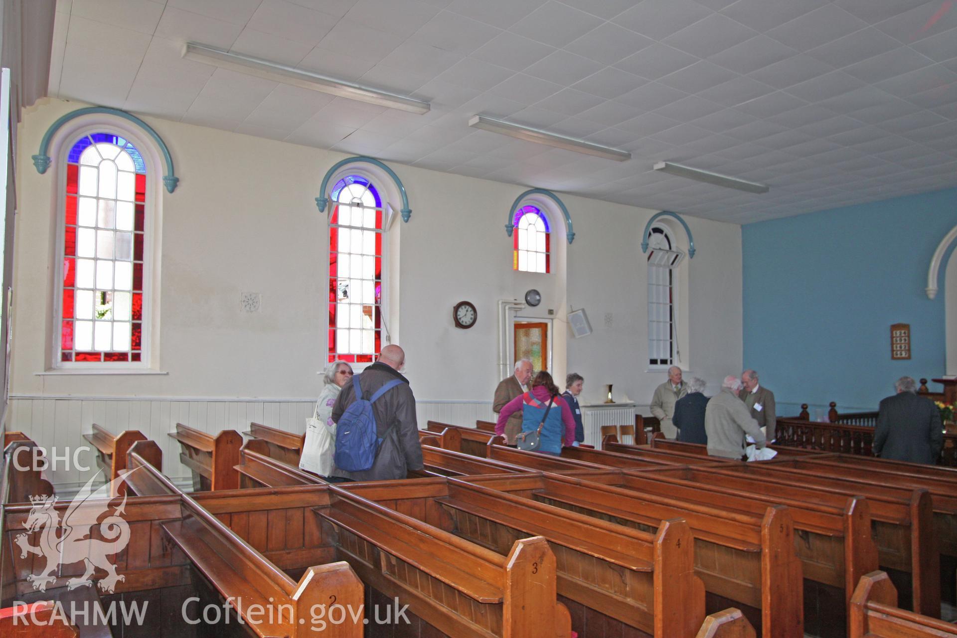 Internal, view of long wall, showing arched stained glass windows