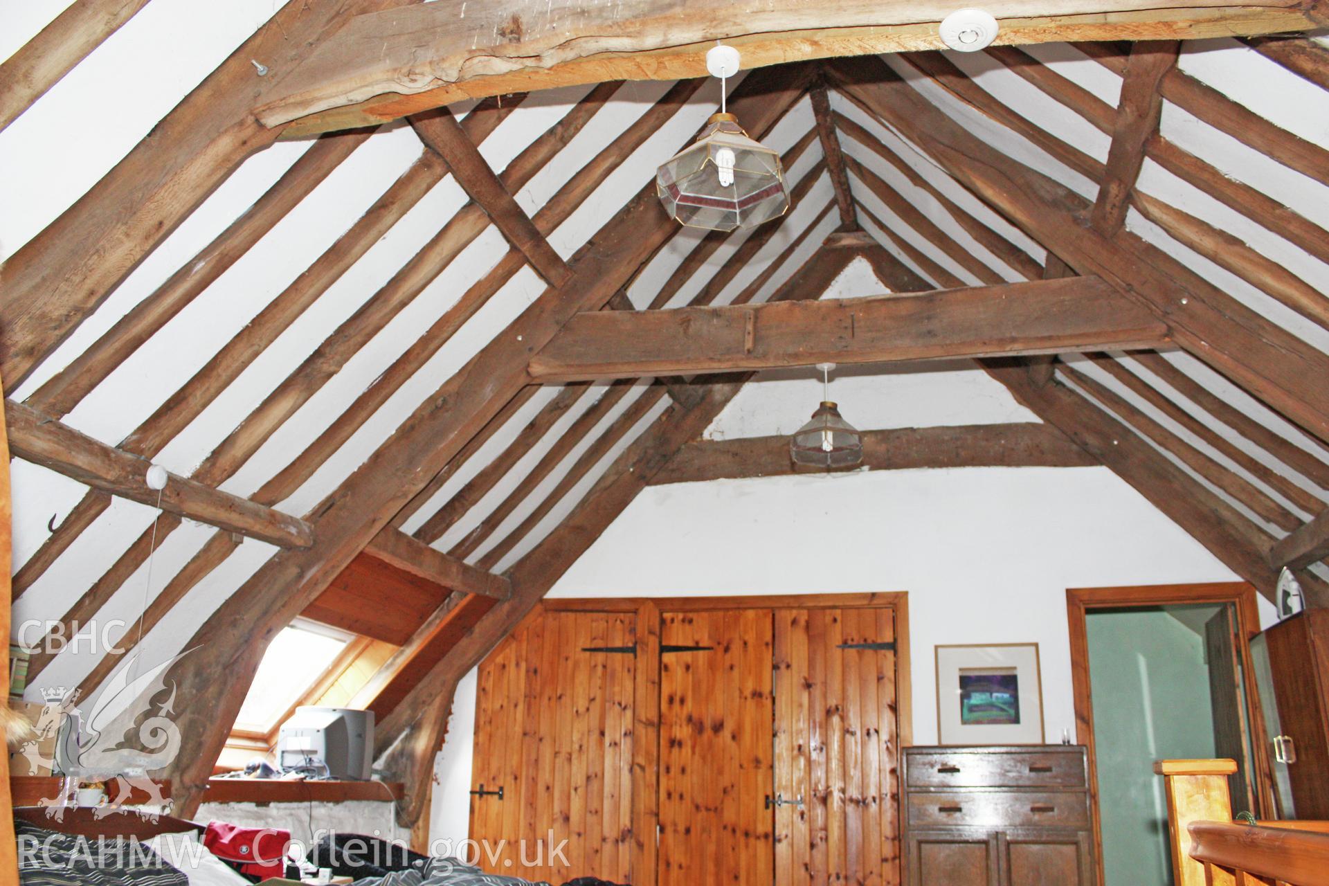 Glantywi House bakehouse, interior view, roof trusses to west end.