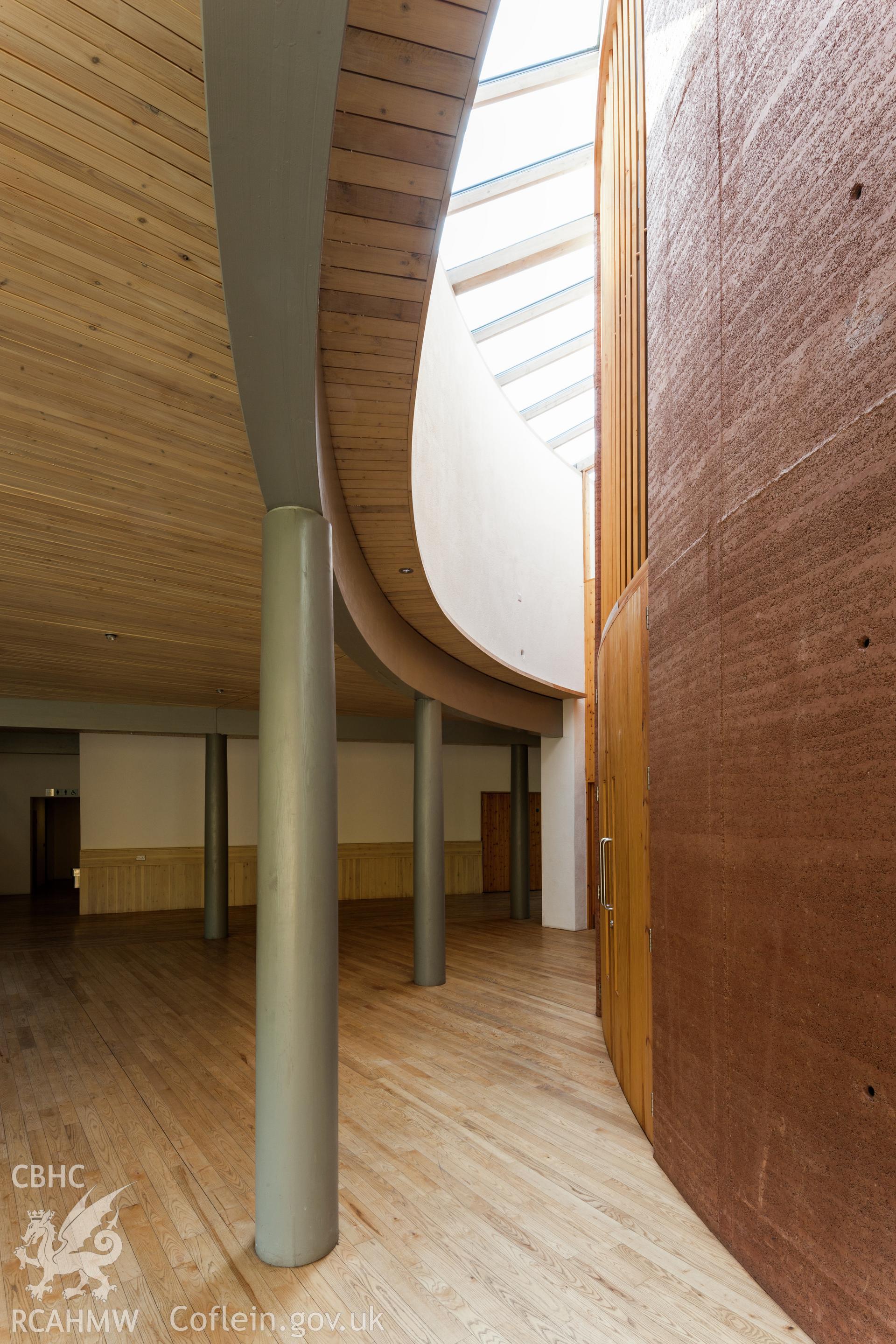 Interior view of rammed earth wall of lecture theatre.