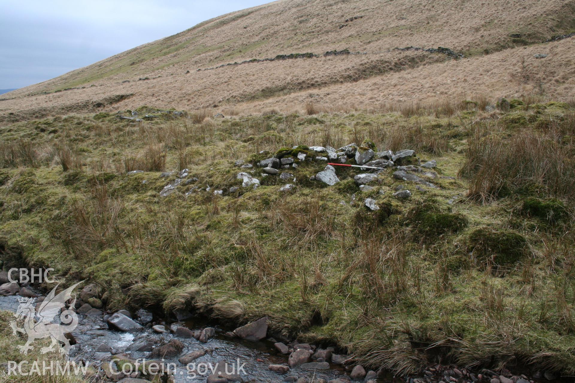 Wall on river bank seen from the north-east; 1m scale.