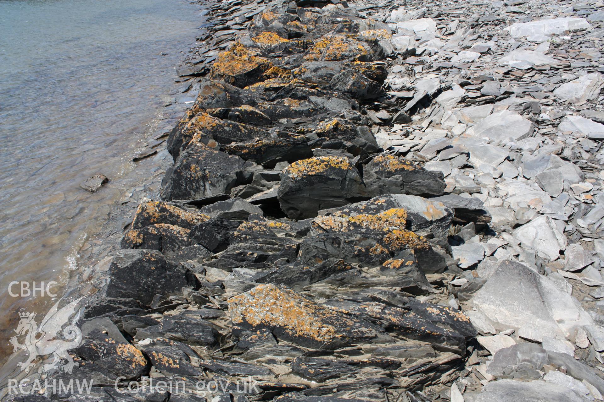 Lower foundation layers of slate waste forming the quay