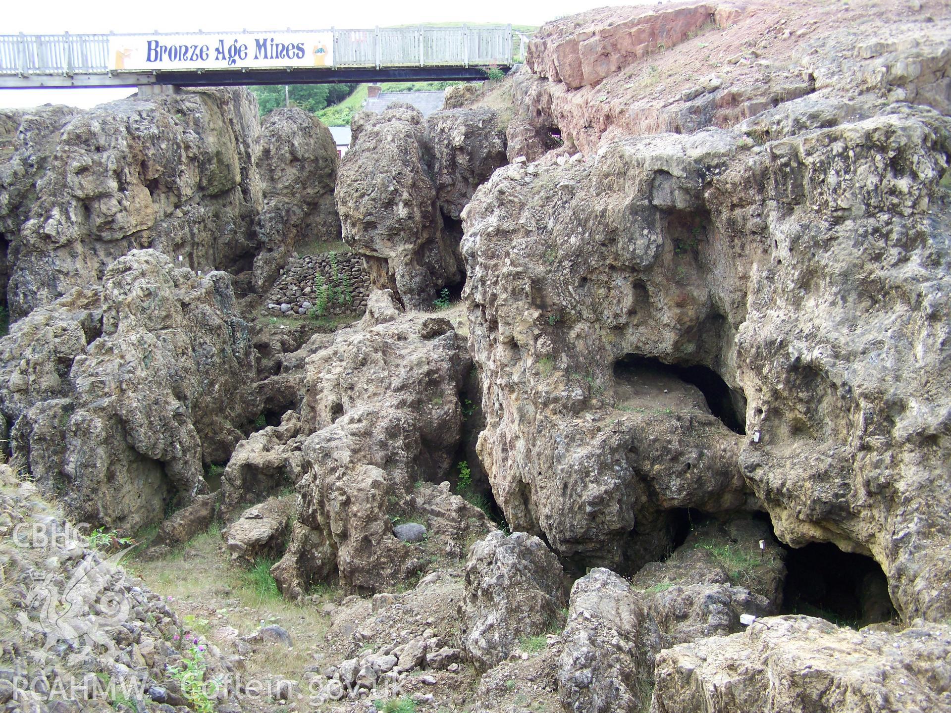 View from northern rim of mine looking south revealing tunnel entrances and areas of dumped waste still to be excavated