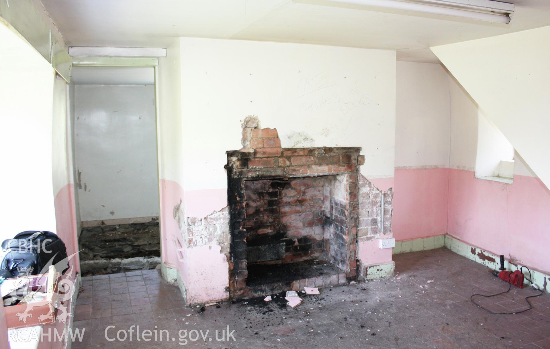 Kitche/hall brick fireplace.