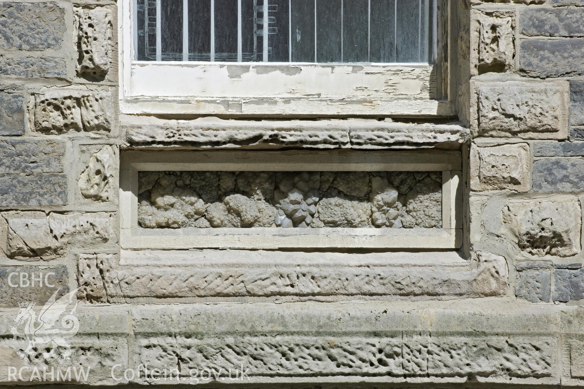 Detail of rock sample decoration below (R) window.