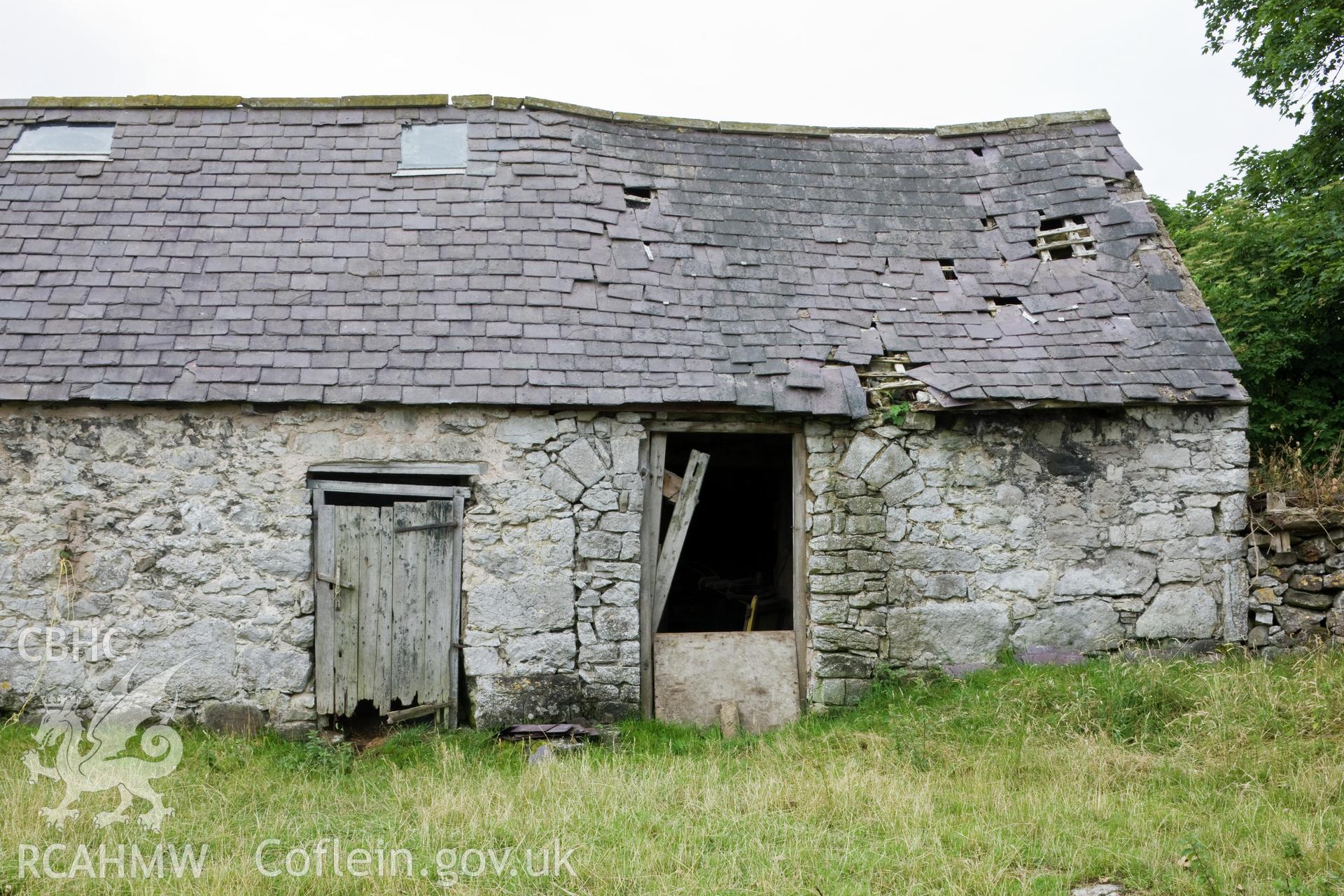 Cart shed with blocked/replaced door.