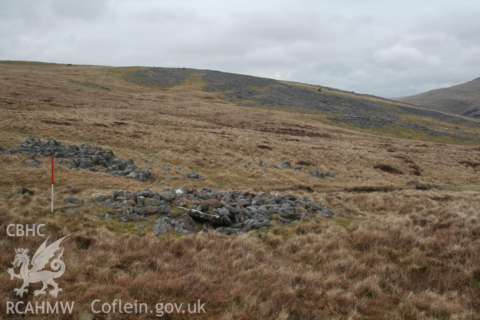 Cairn alongside track, seen from the south-west; 1m scale.