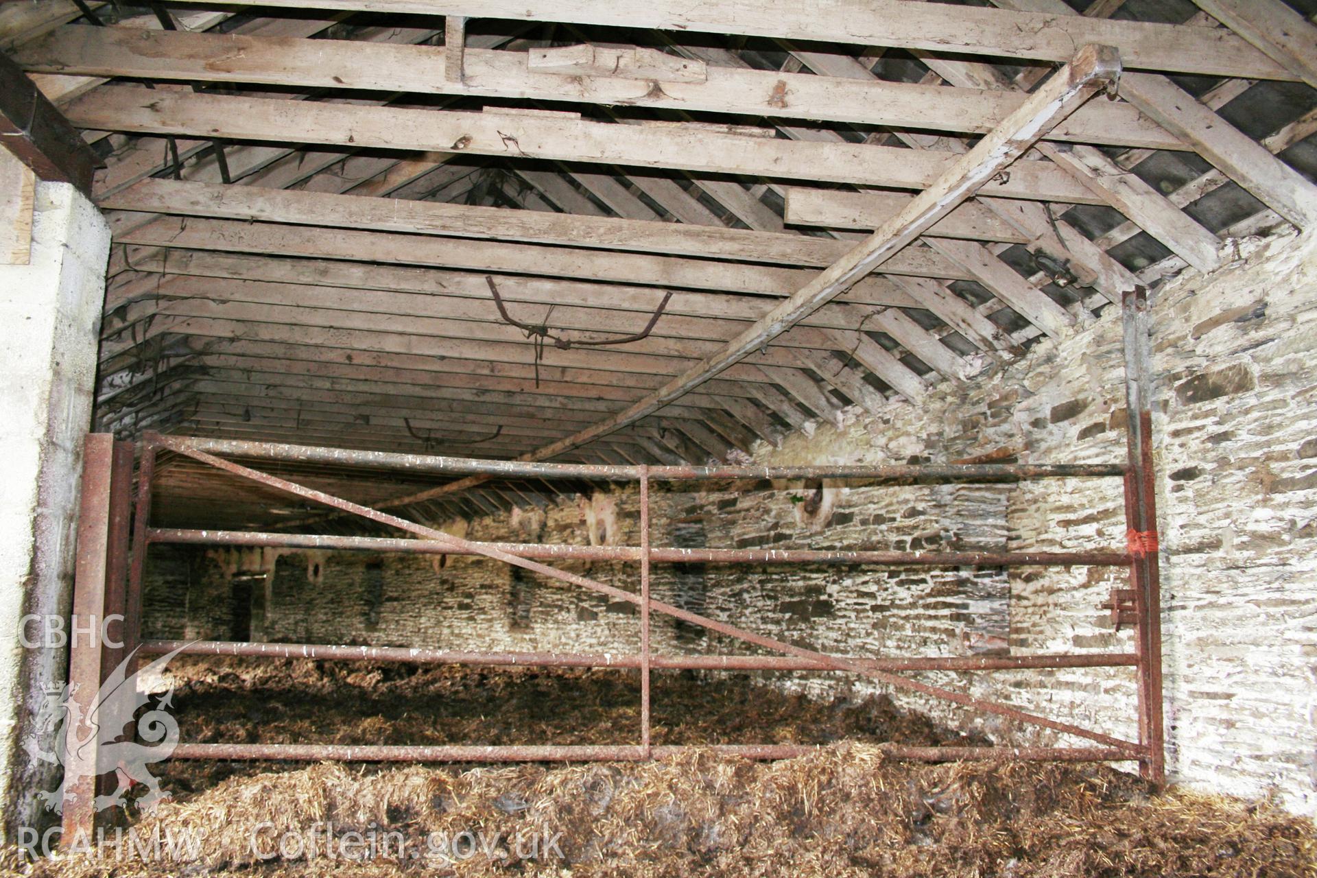 Interior view of semi-circular cattle housing to east, looking north.