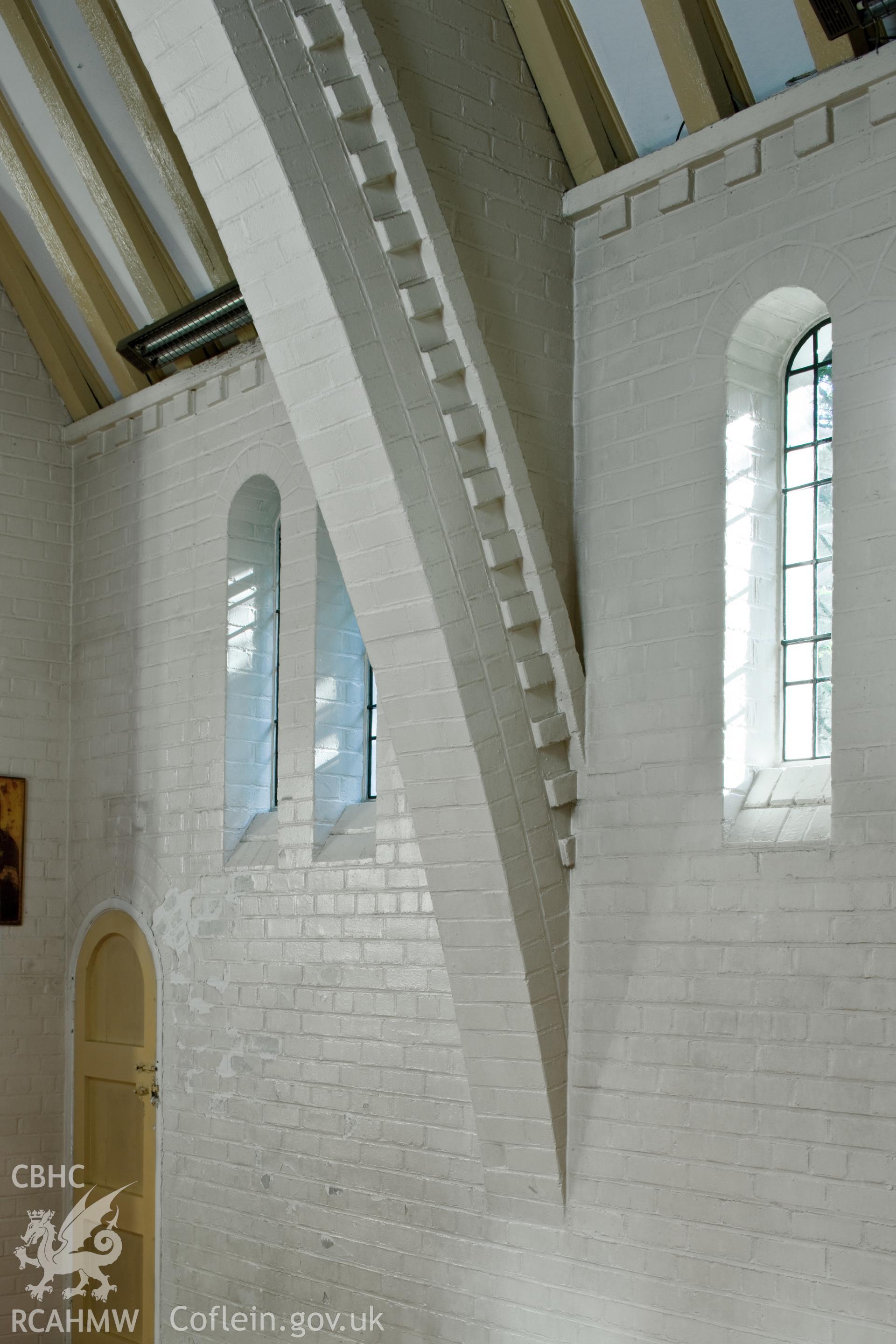 Detail of brickwork, windows and arch.