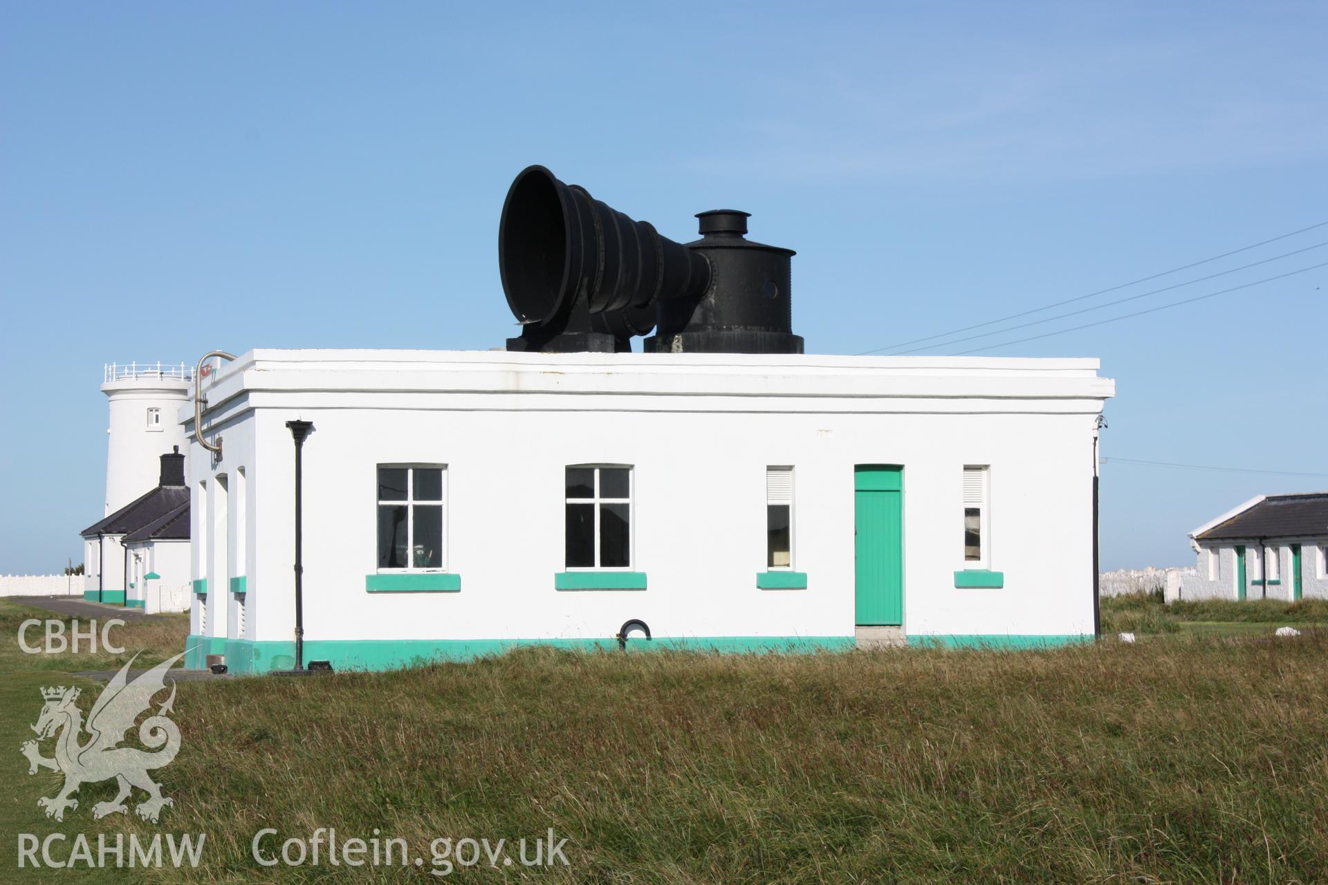 Building viewed from east showing signal horn on roof (west lighthouse in background)