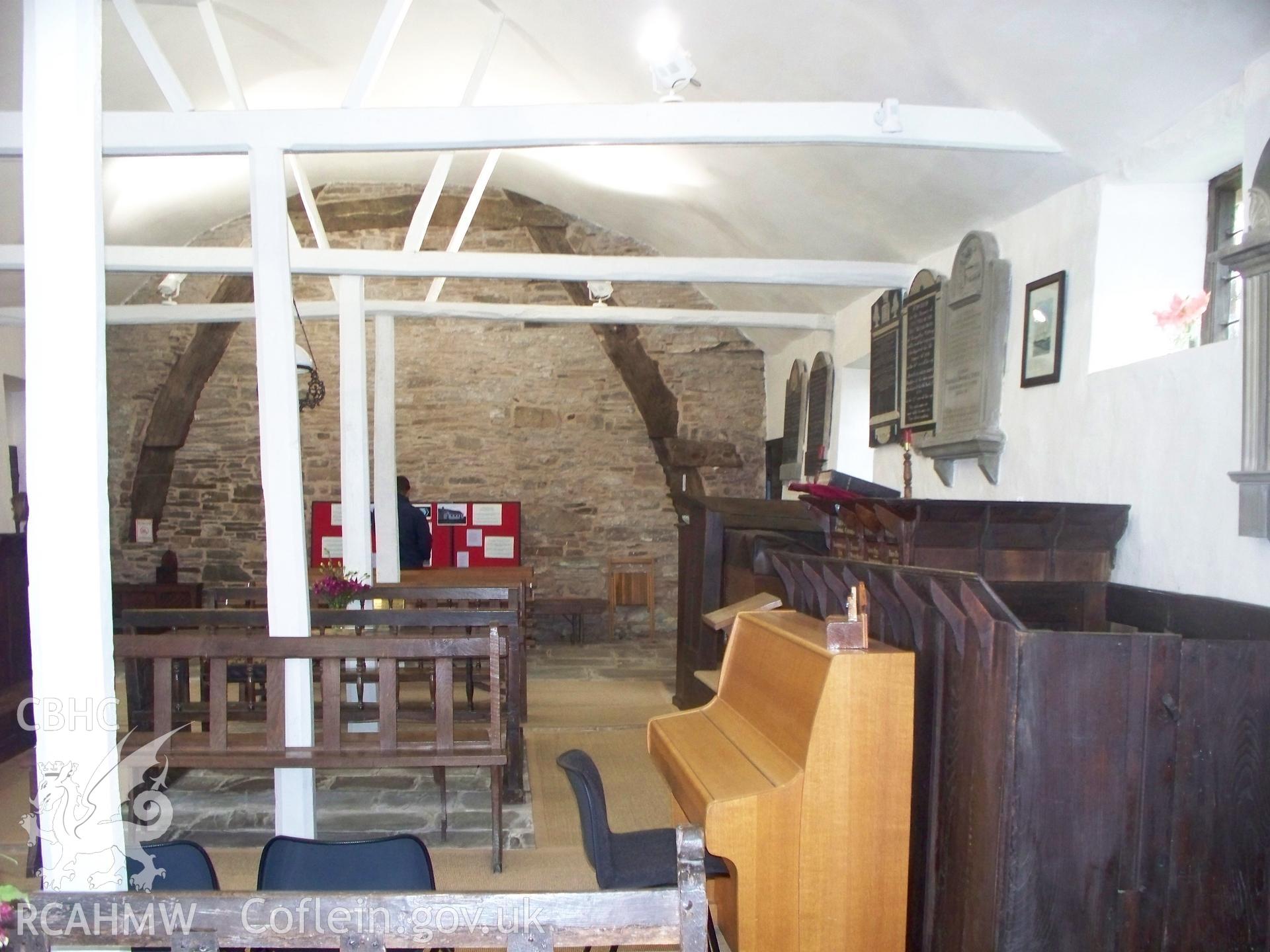 Interior looking north west to cruck in gable.