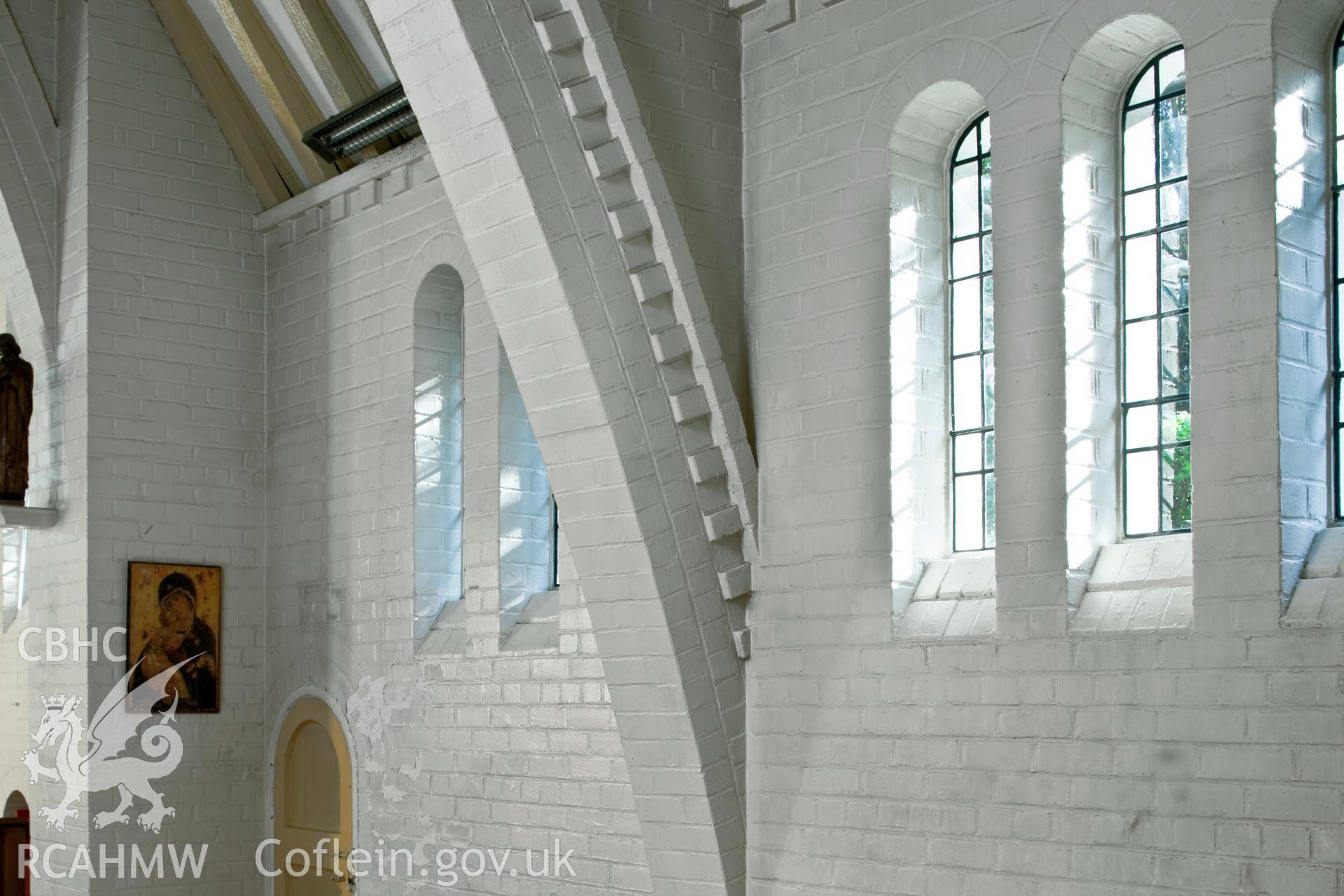 Detail of brickwork, windows and arch.