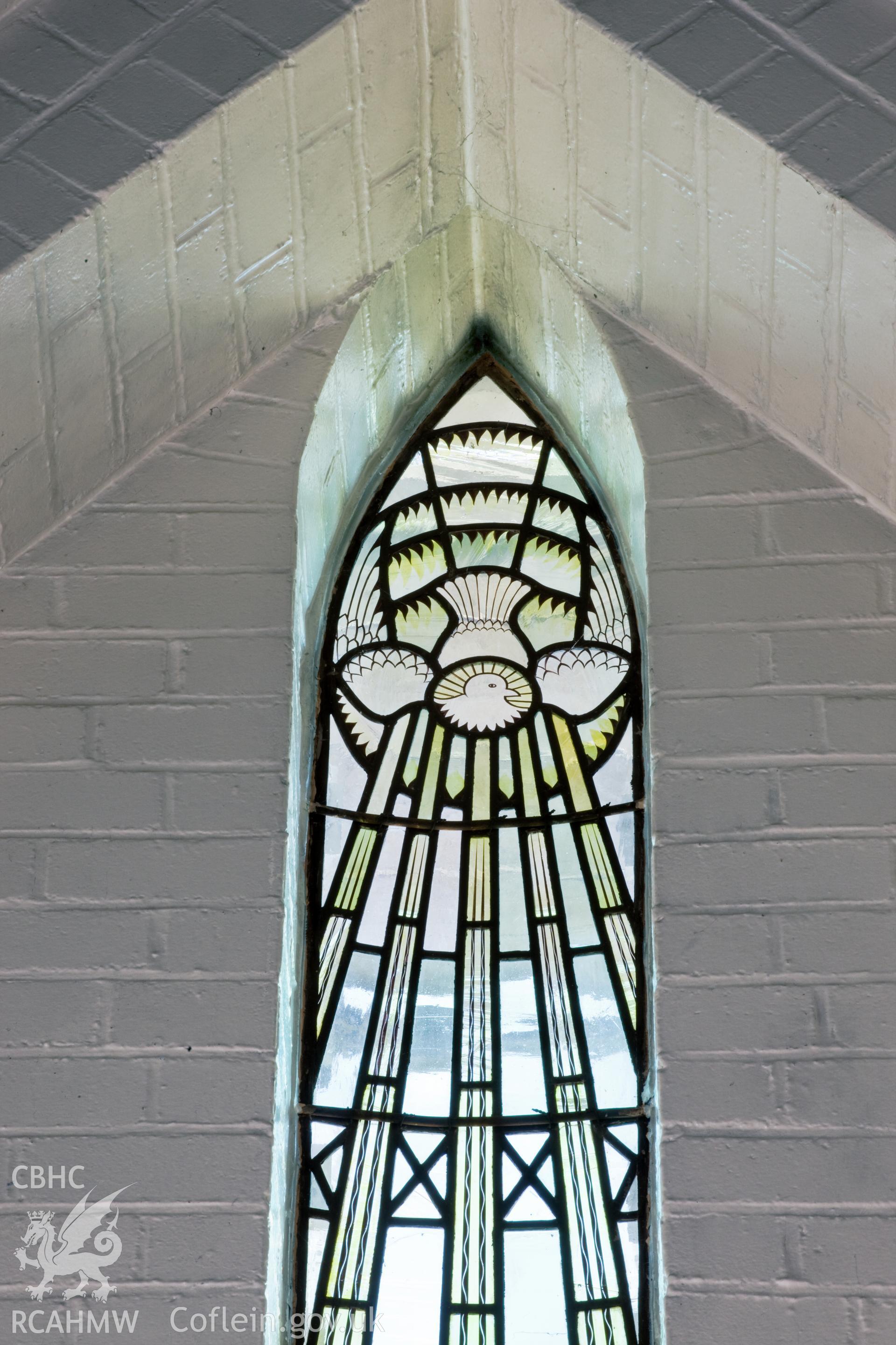 Detail of stained glass over altar.
