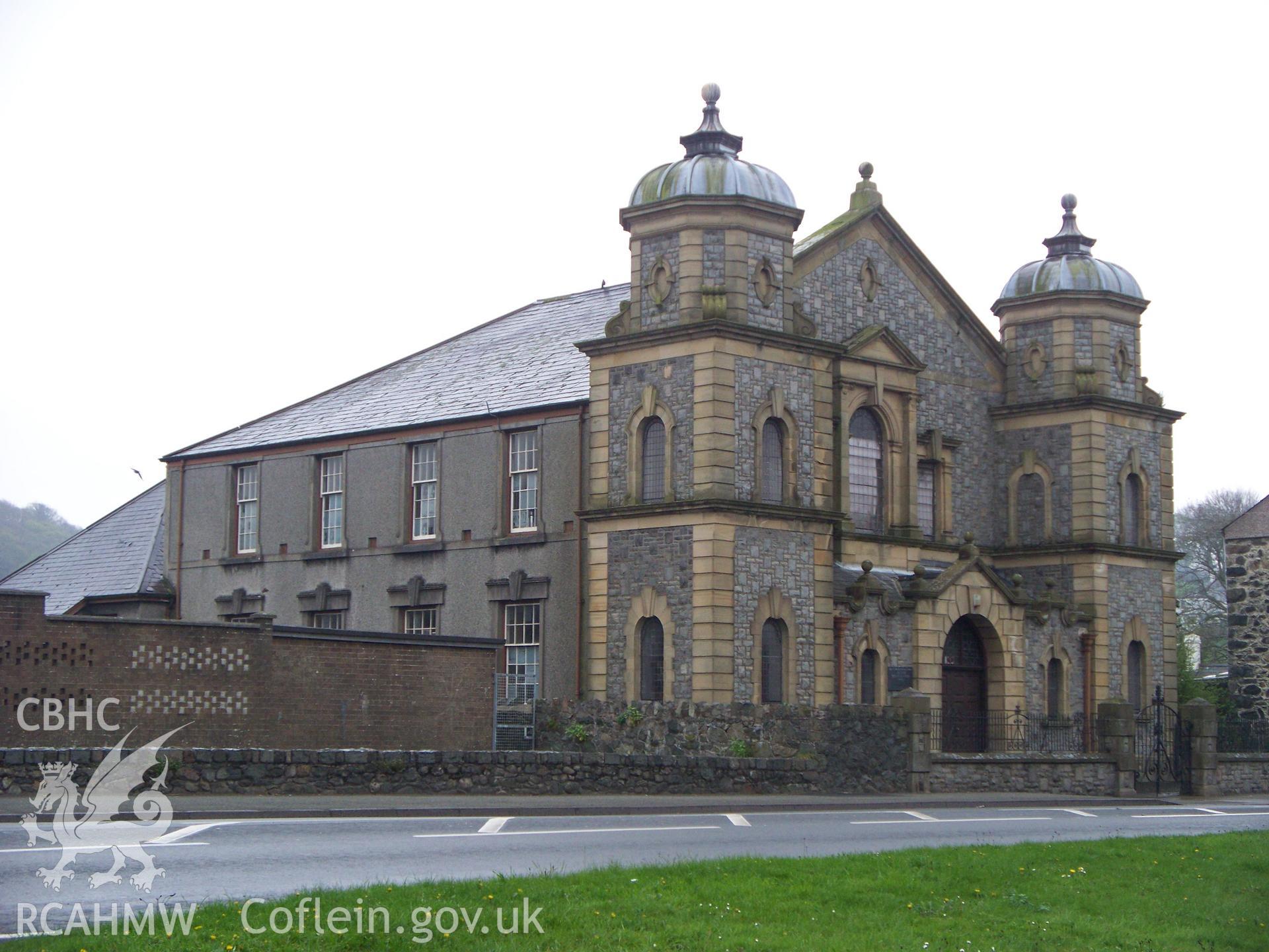 Left-hand 3/4 elevation and front entrance.