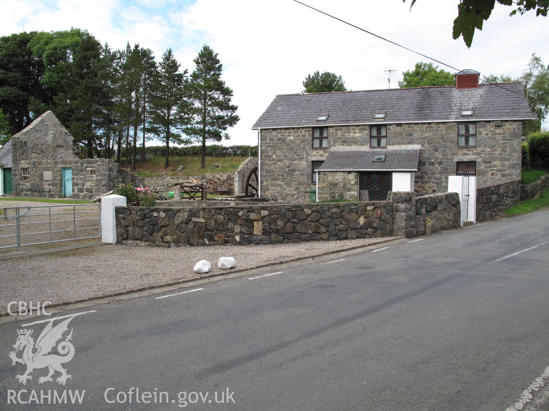 Corn mill viewed from the southwest with former mill house to the left.